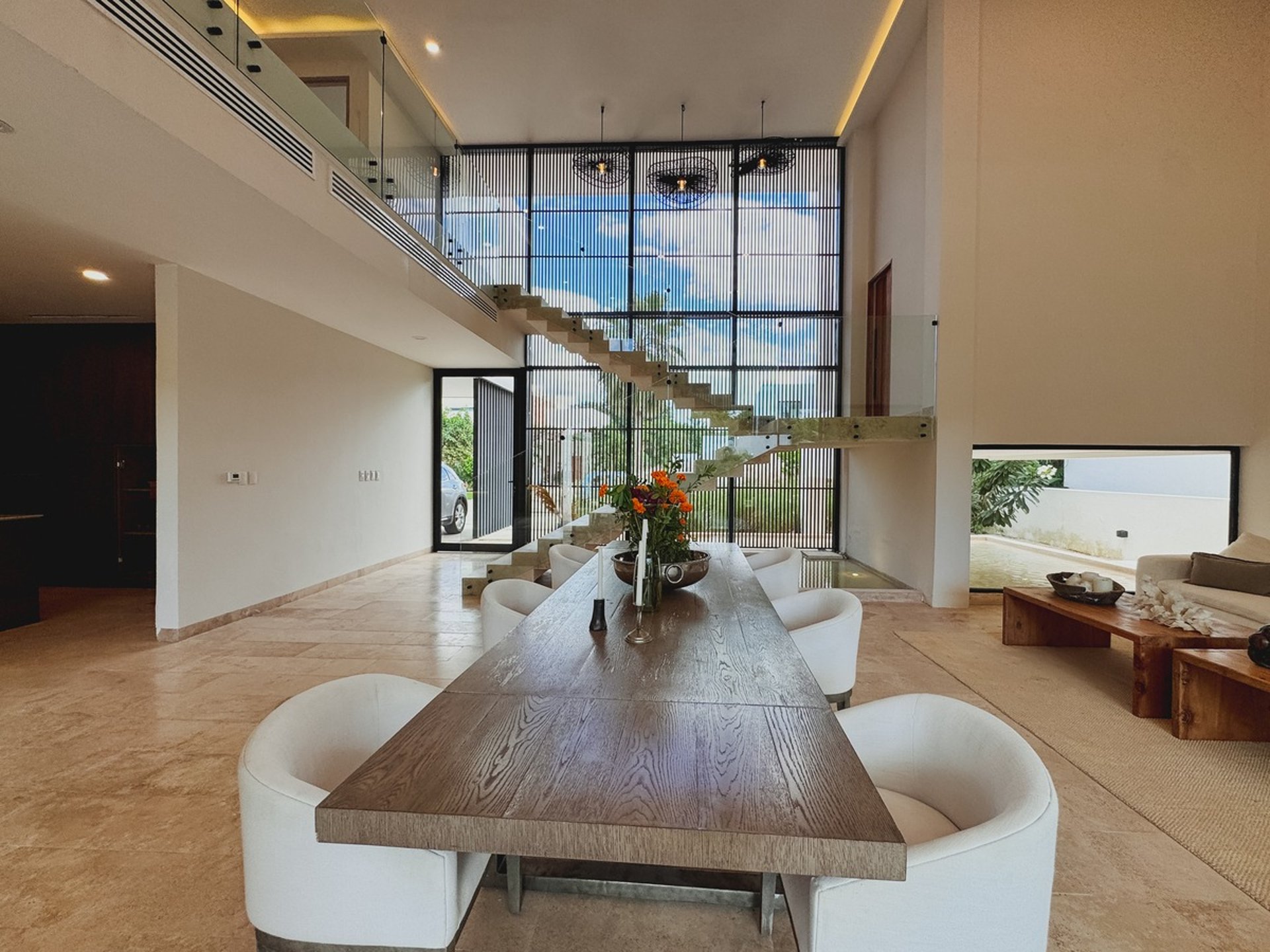 an abstract photo of a curved building with a blue sky in the background