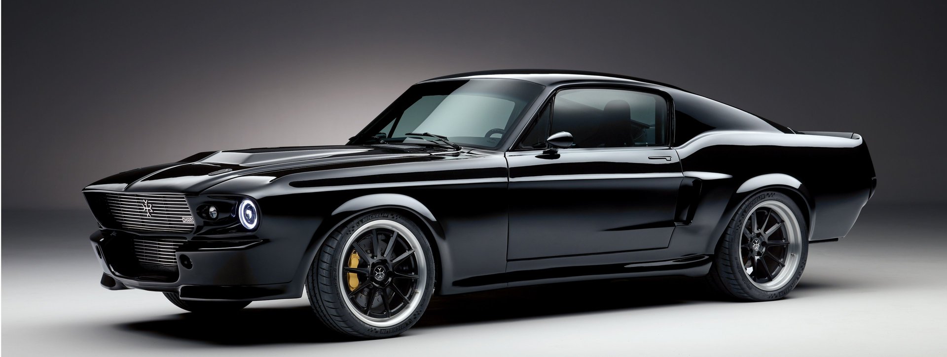 an abstract photo of a curved building with a blue sky in the background