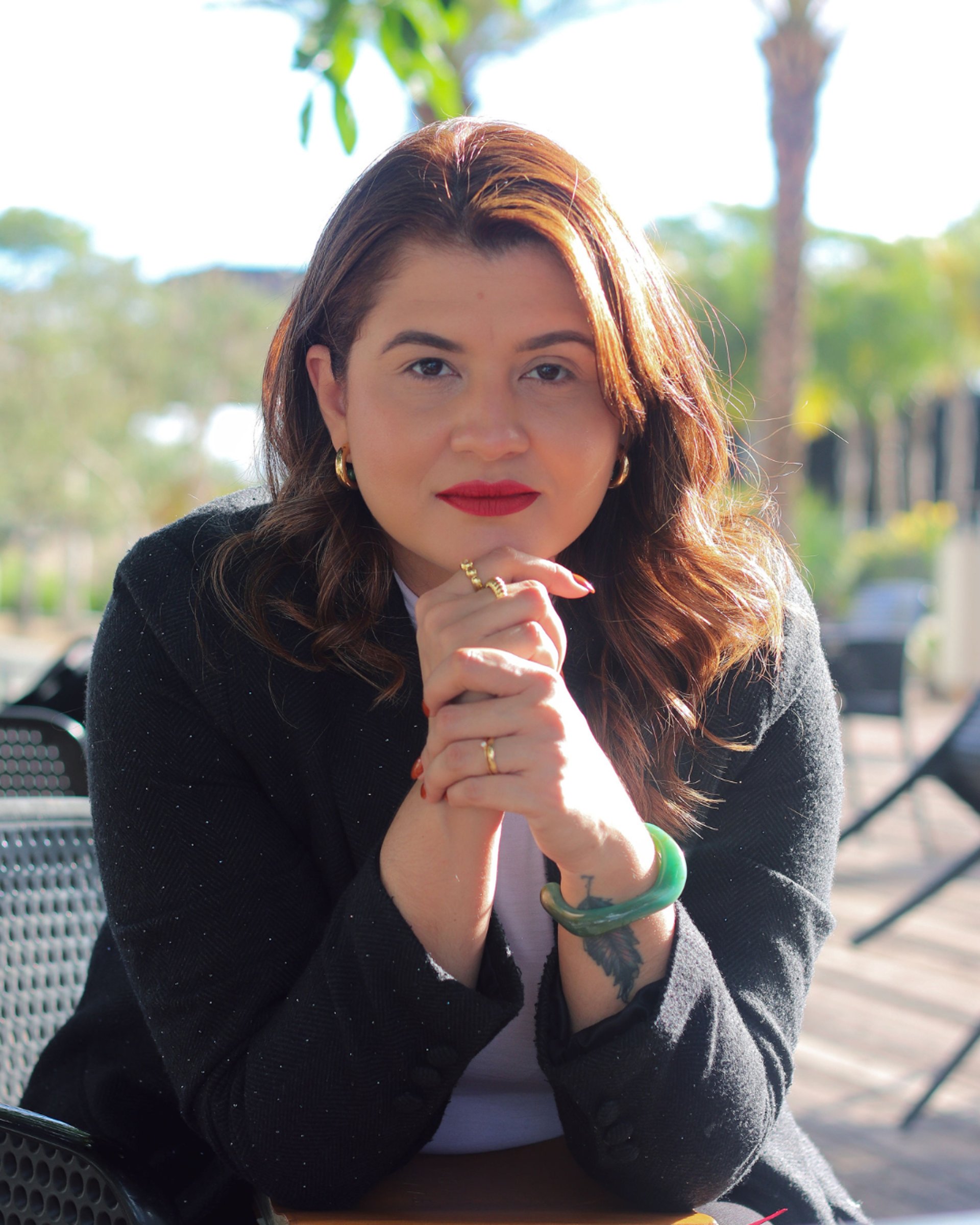 woman wearing yellow long-sleeved dress under white clouds and blue sky during daytime
