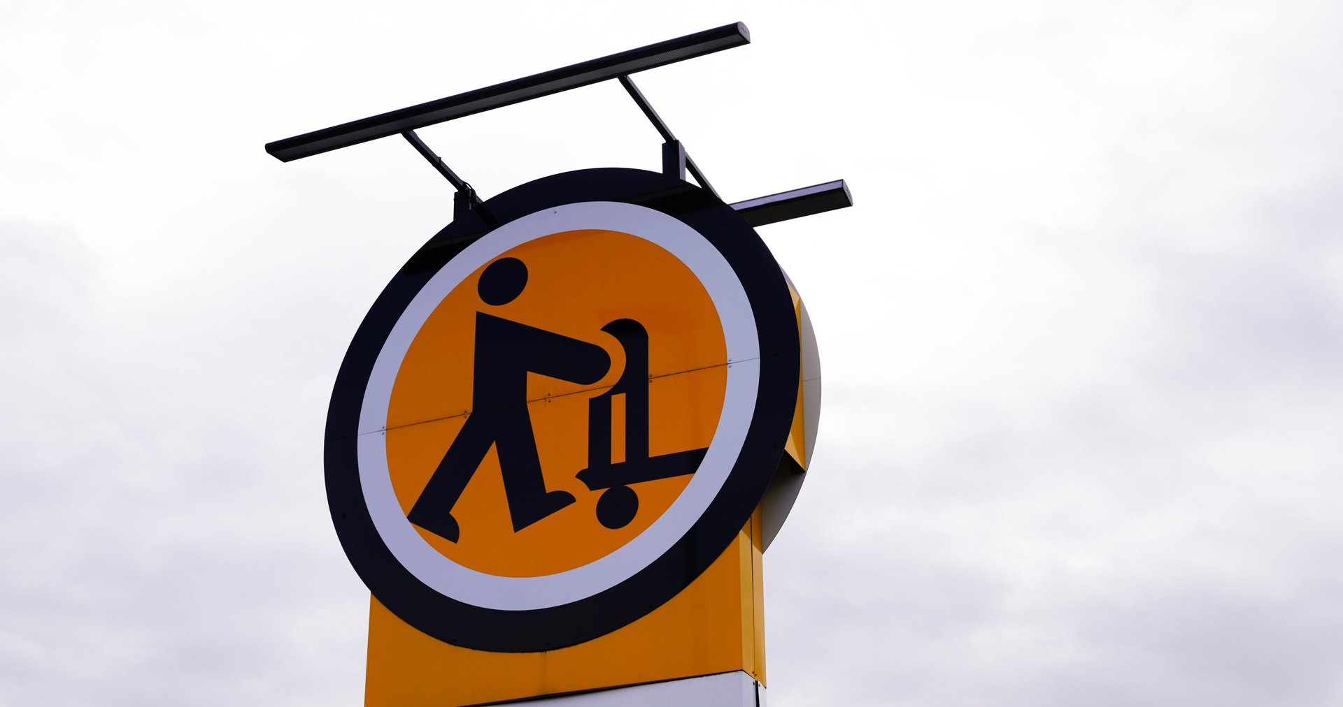 an abstract photo of a curved building with a blue sky in the background