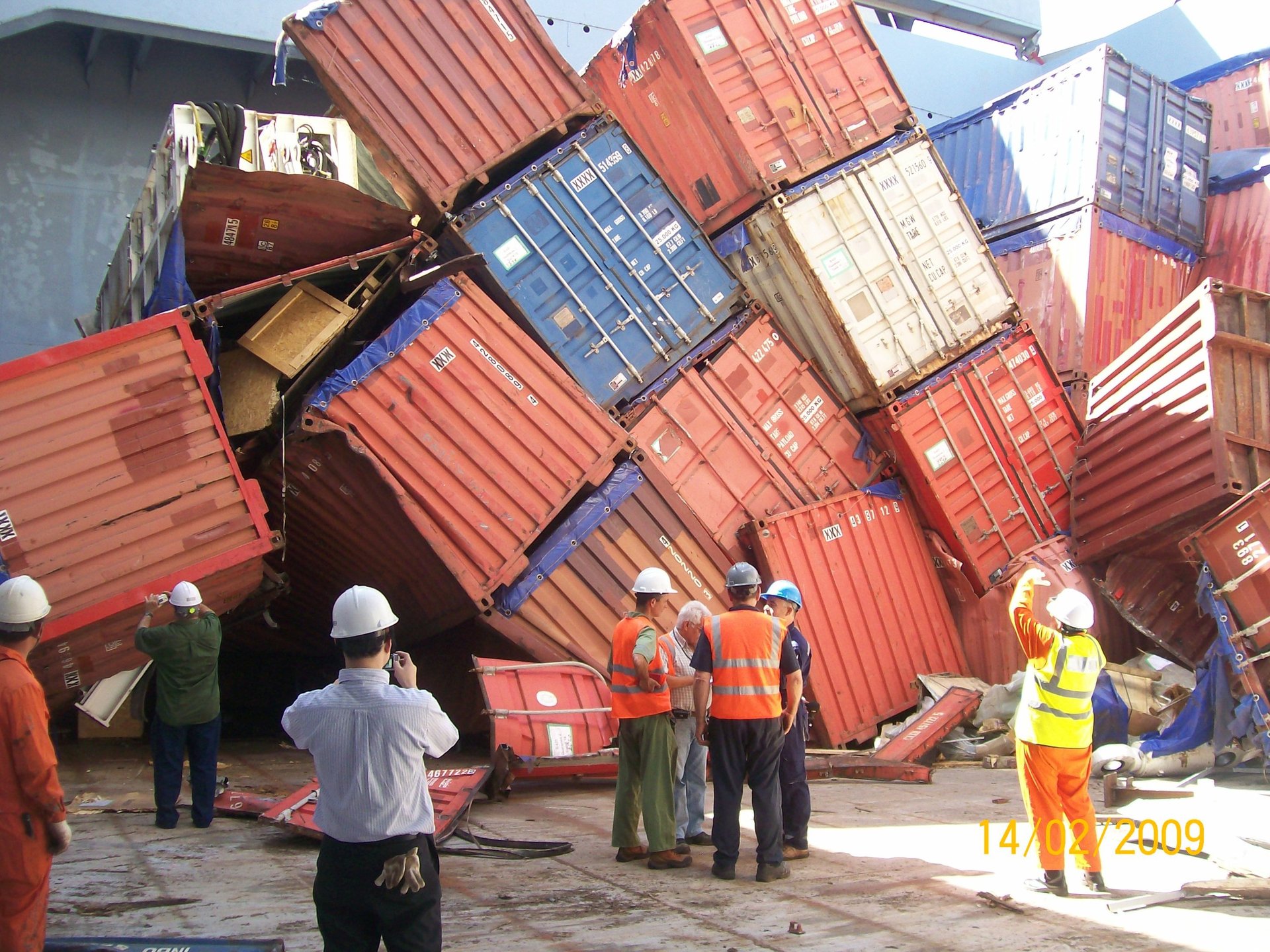 woman in orange jacket and white cap standing on boat during daytime