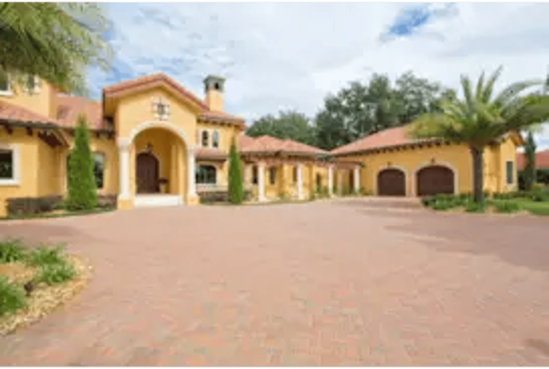 a living room filled with furniture and a view of the ocean