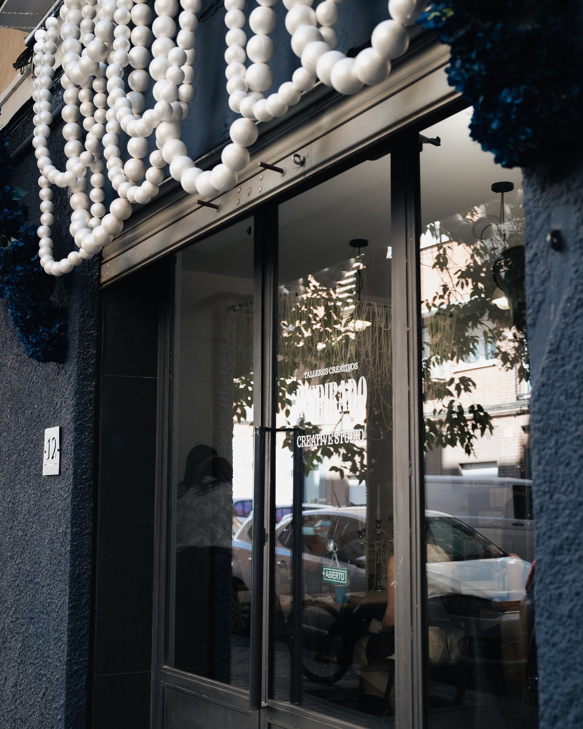 an abstract photo of a curved building with a blue sky in the background