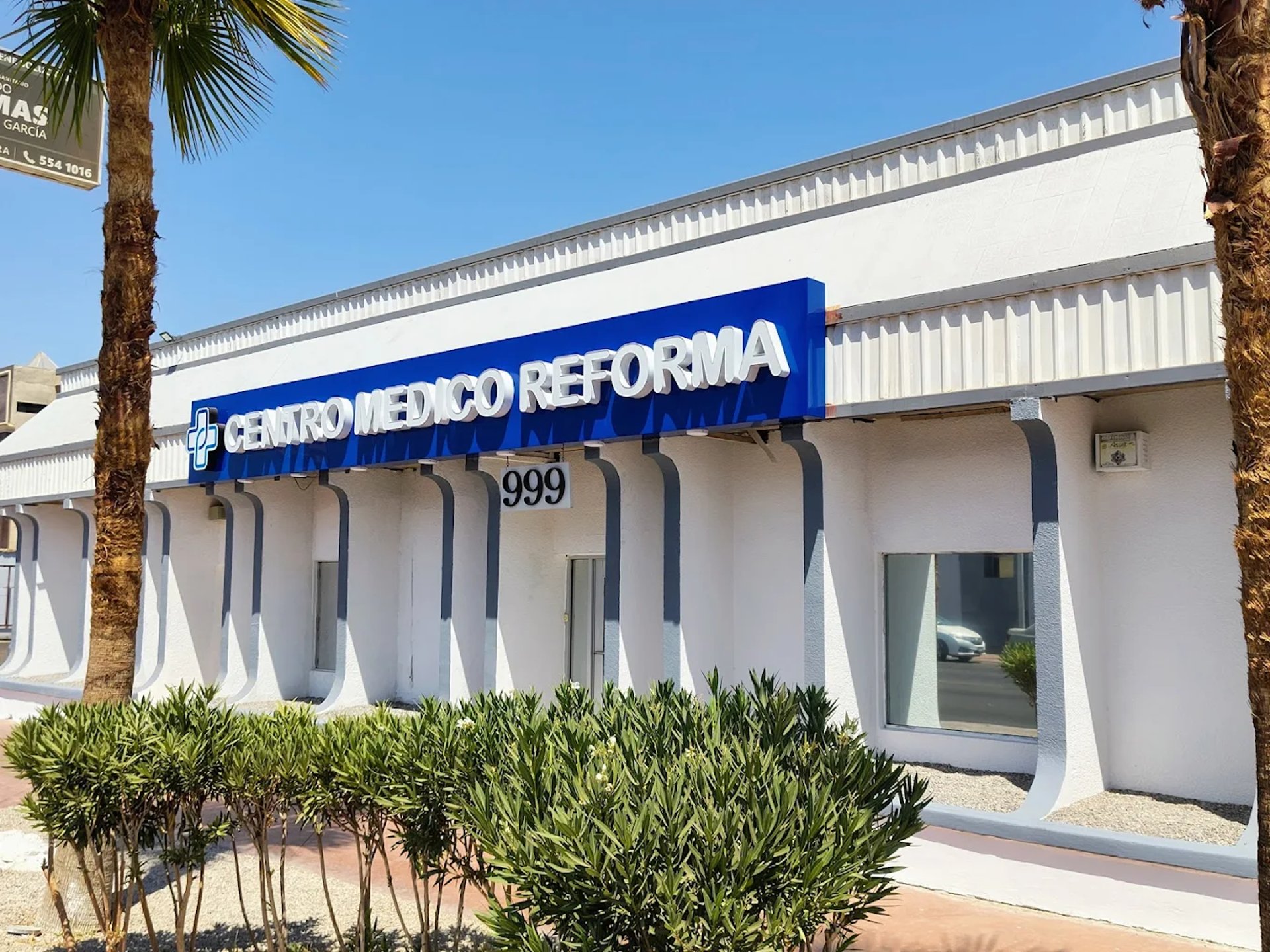 woman wearing yellow long-sleeved dress under white clouds and blue sky during daytime