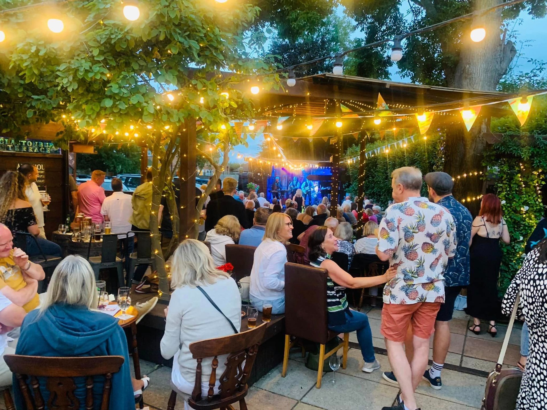 woman wearing yellow long-sleeved dress under white clouds and blue sky during daytime