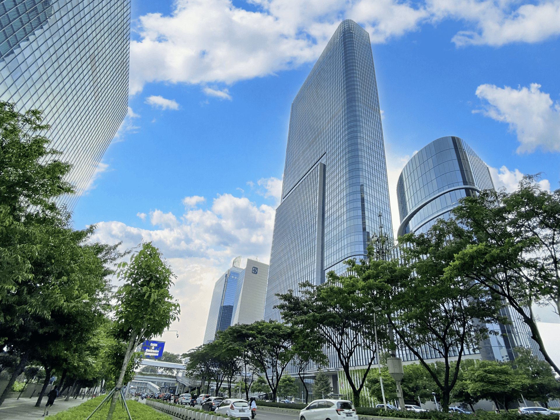 an abstract photo of a curved building with a blue sky in the background