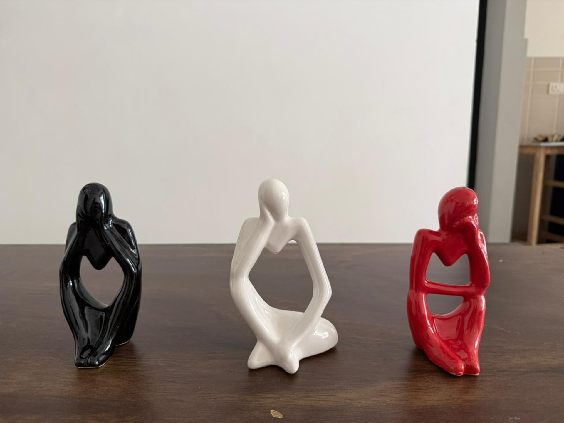 a brown leather couch sitting in front of a white wall