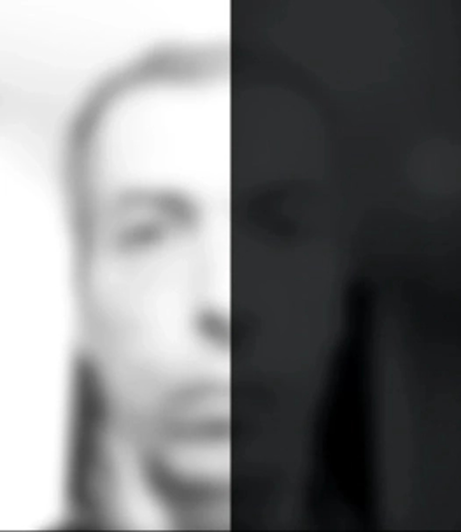 an abstract photo of a curved building with a blue sky in the background