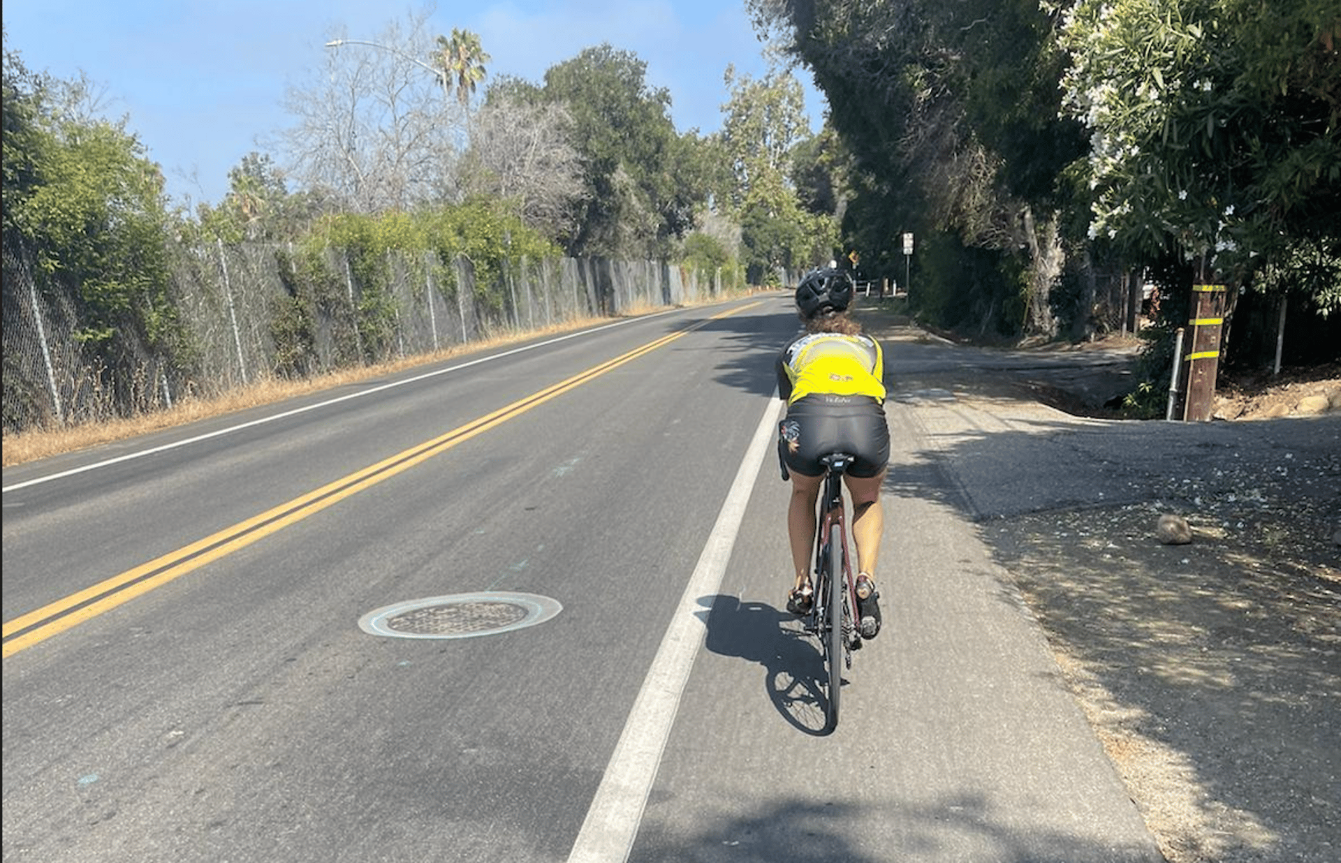 woman wearing yellow long-sleeved dress under white clouds and blue sky during daytime
