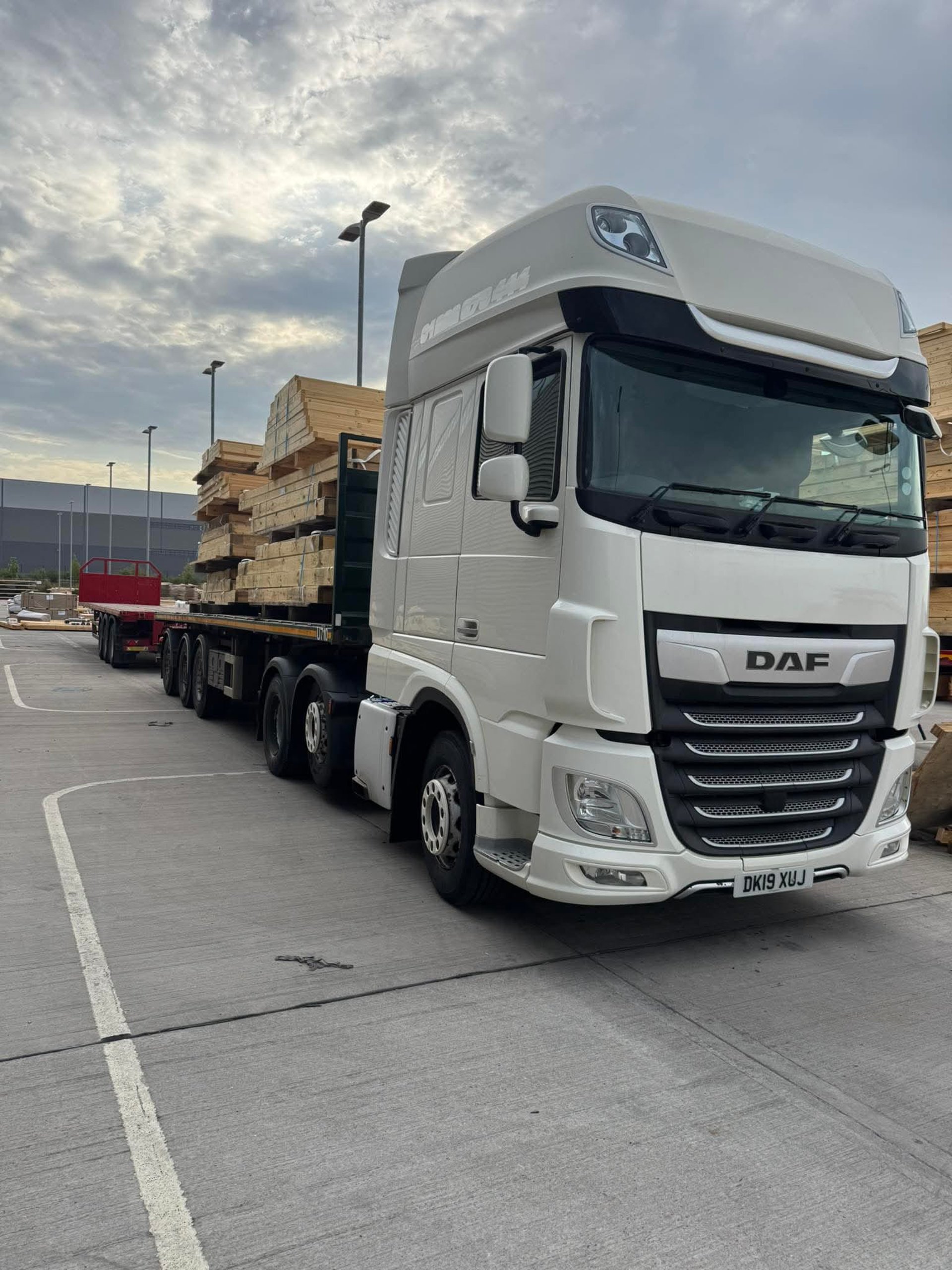 Couple looking at tablet surrounded by moving boxes