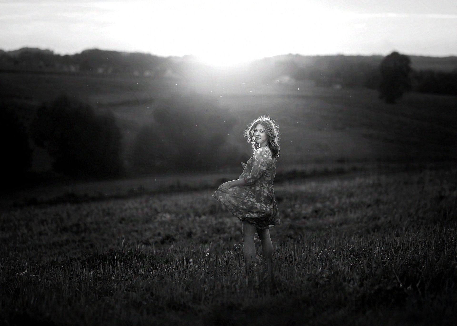 woman wearing yellow long-sleeved dress under white clouds and blue sky during daytime