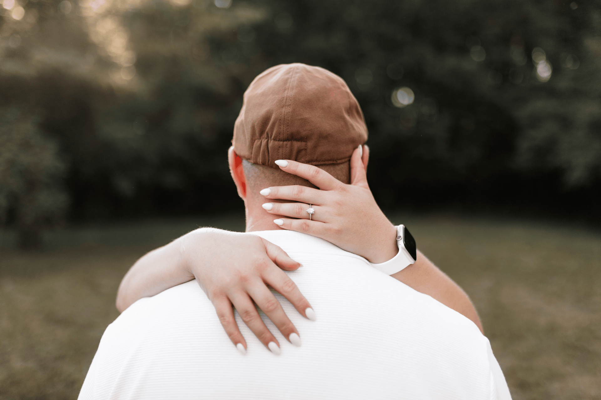 couple wearing silver-colored rings