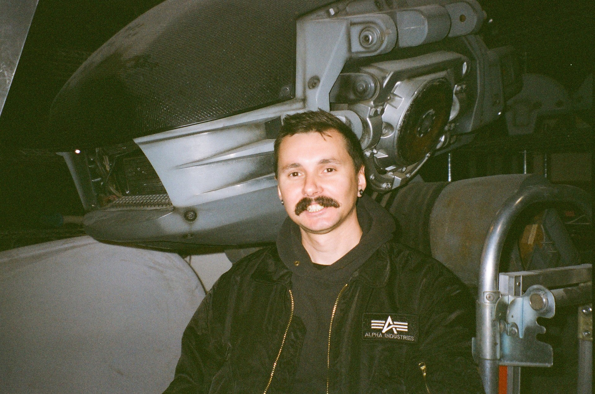 an abstract photo of a curved building with a blue sky in the background