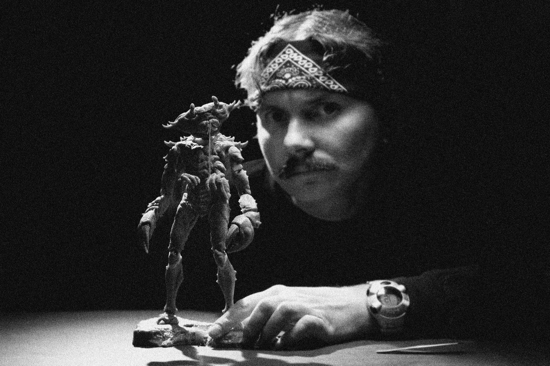 an abstract photo of a curved building with a blue sky in the background