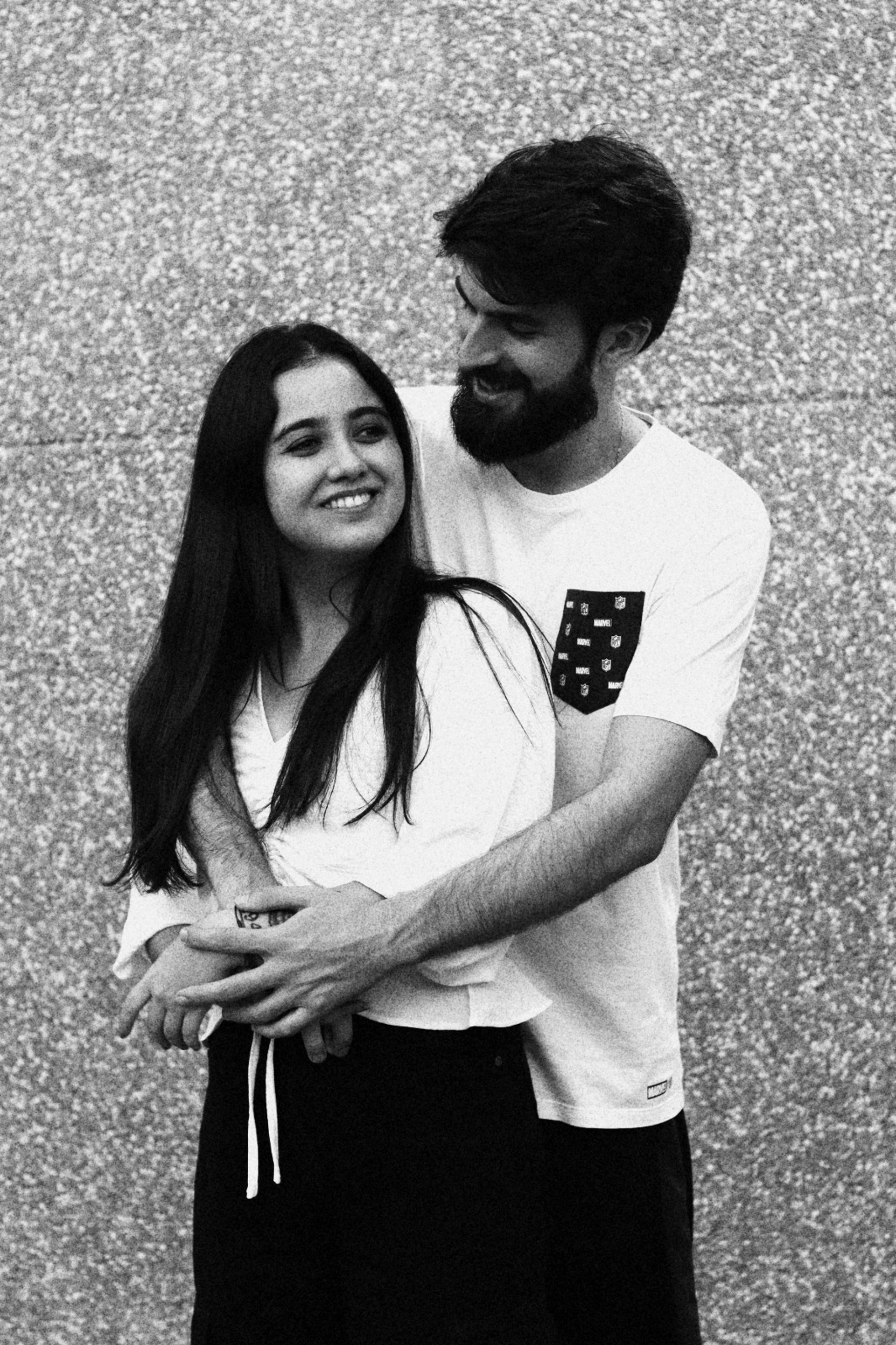 couple wearing silver-colored rings