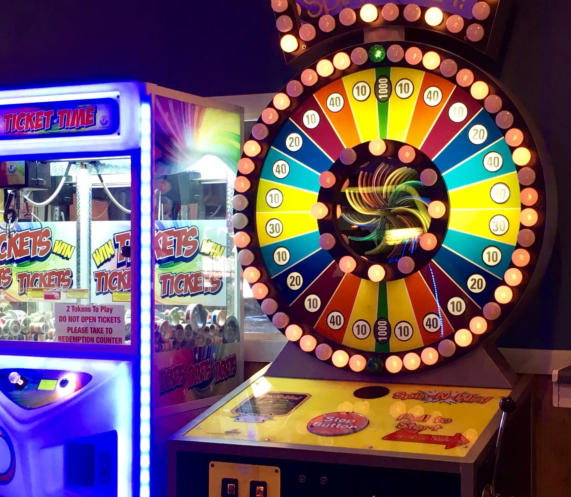 arcade game with wheel and bright lights