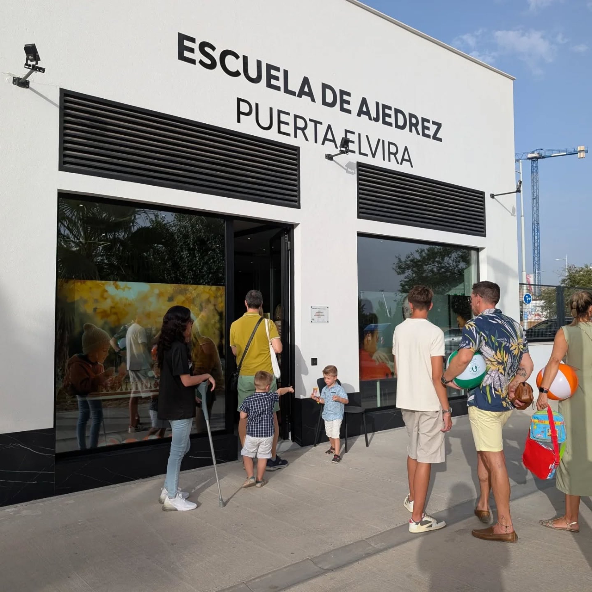 an abstract photo of a curved building with a blue sky in the background