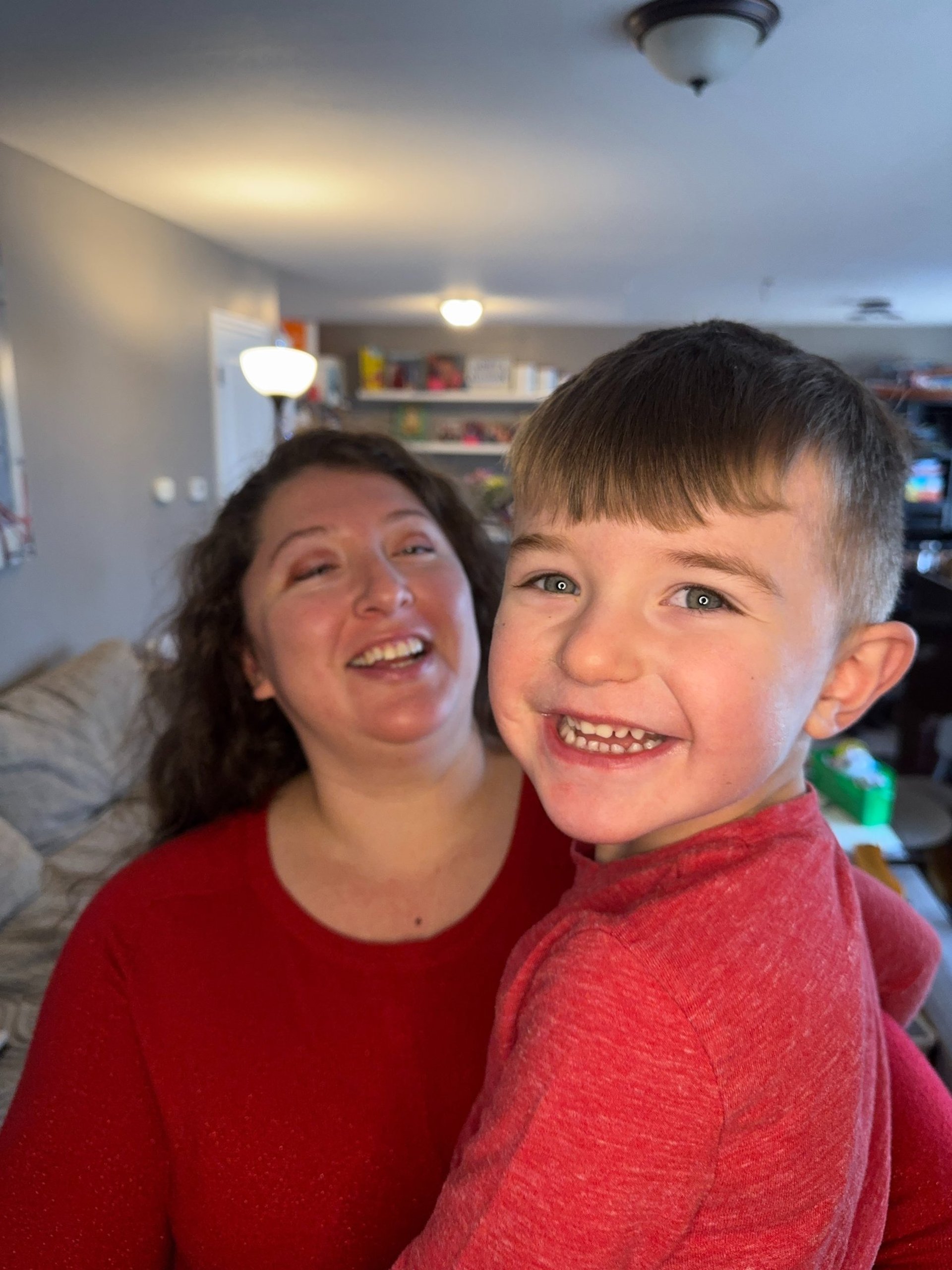 Mother and daughter looking at laptop together