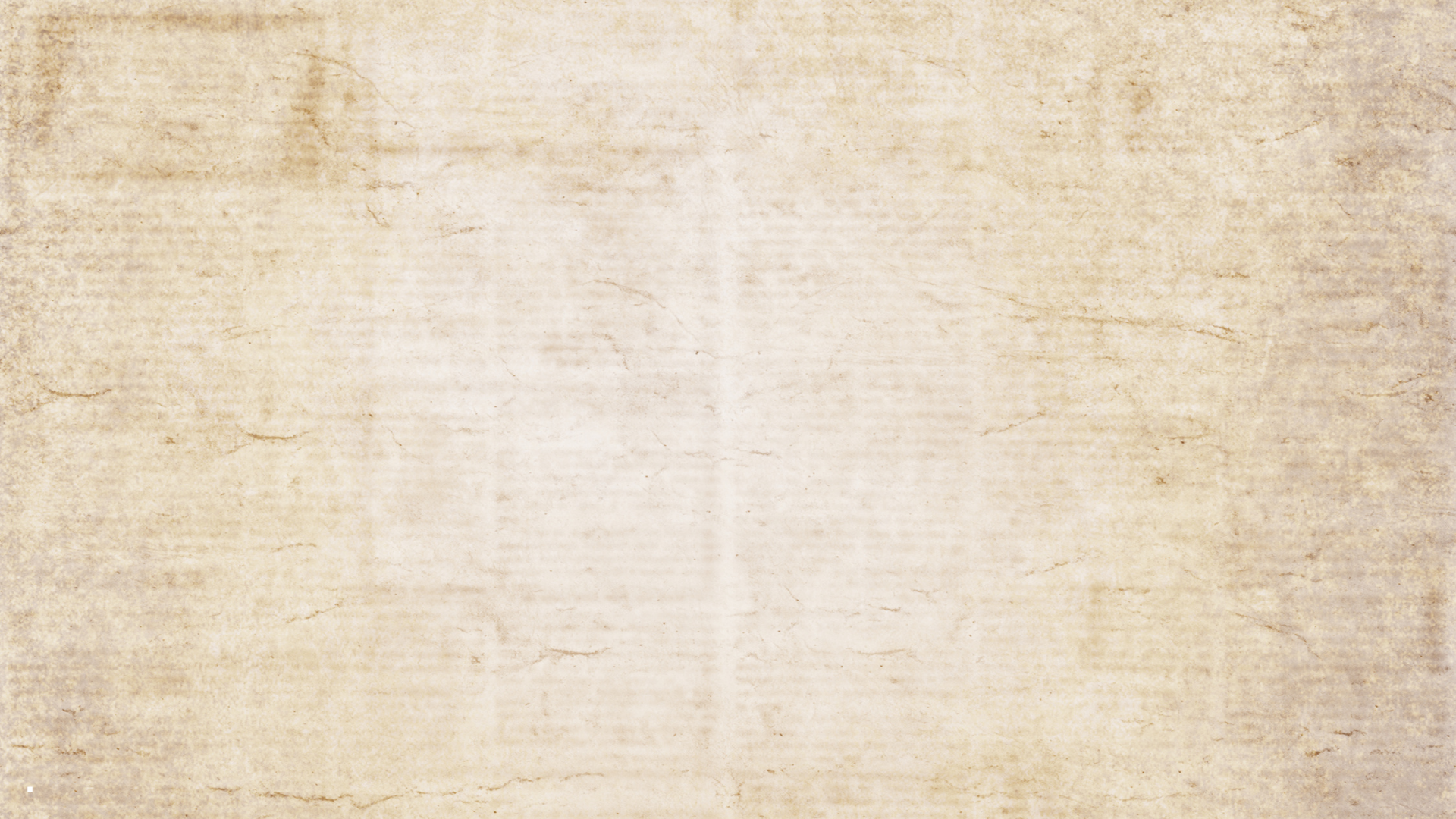 a black and white cat laying on top of a white wall