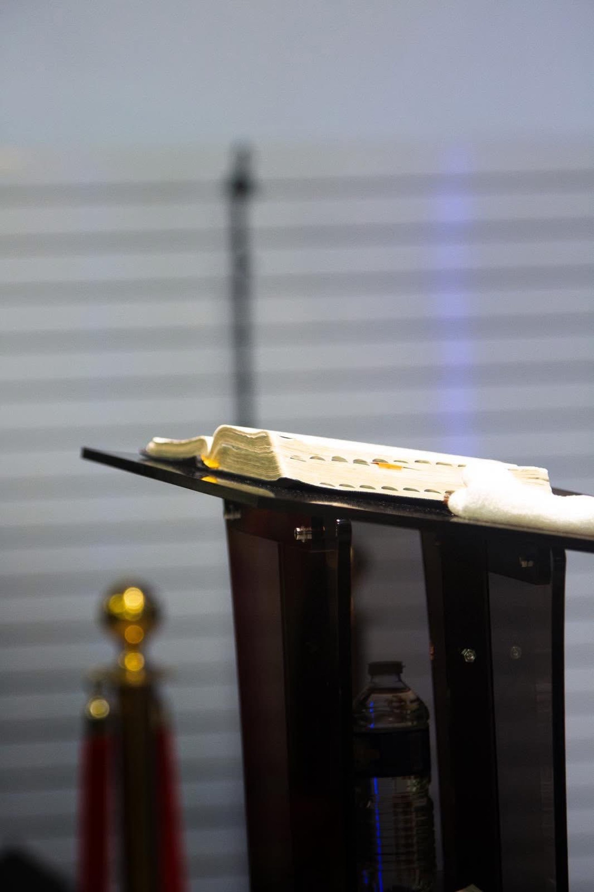 an abstract photo of a curved building with a blue sky in the background