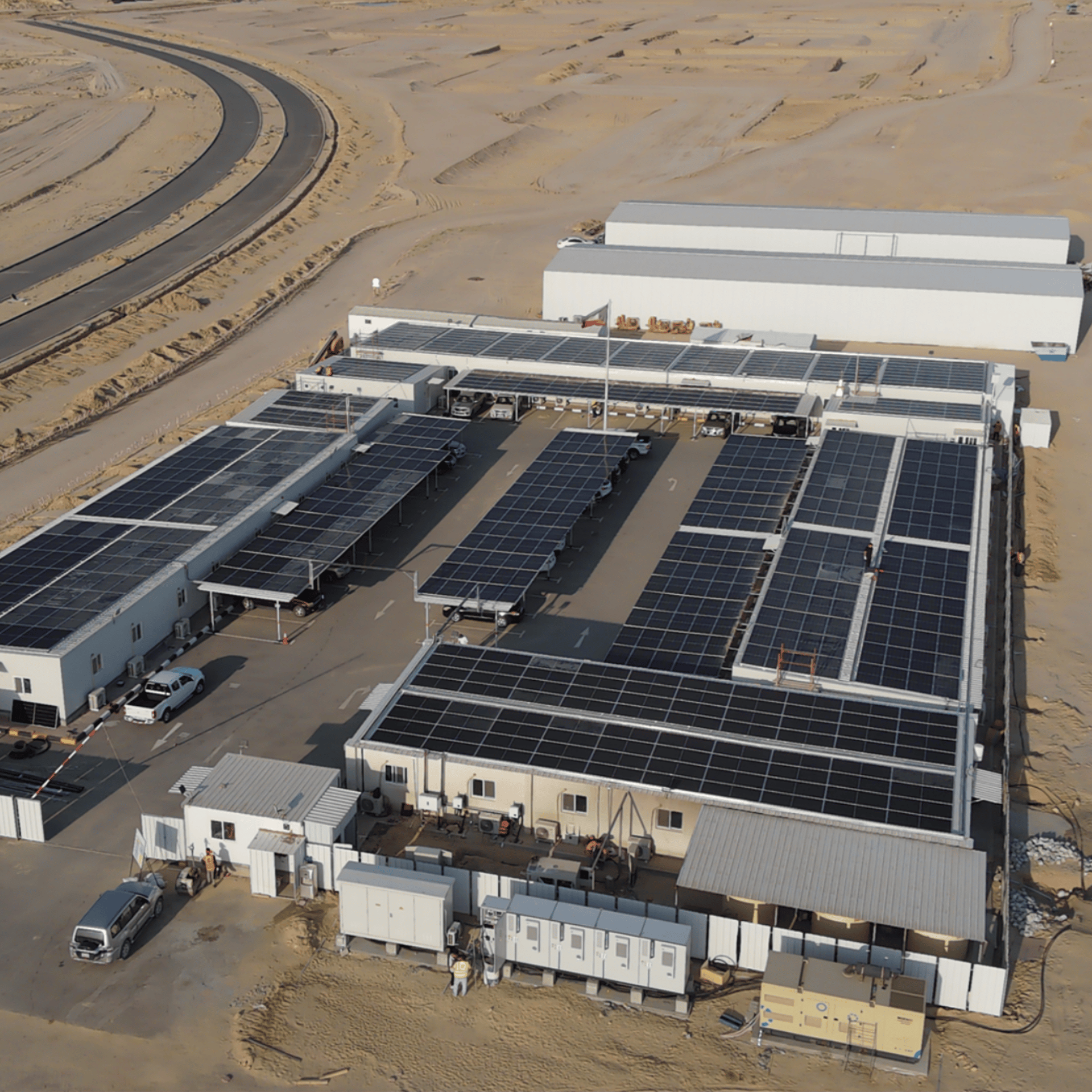 an abstract photo of a curved building with a blue sky in the background