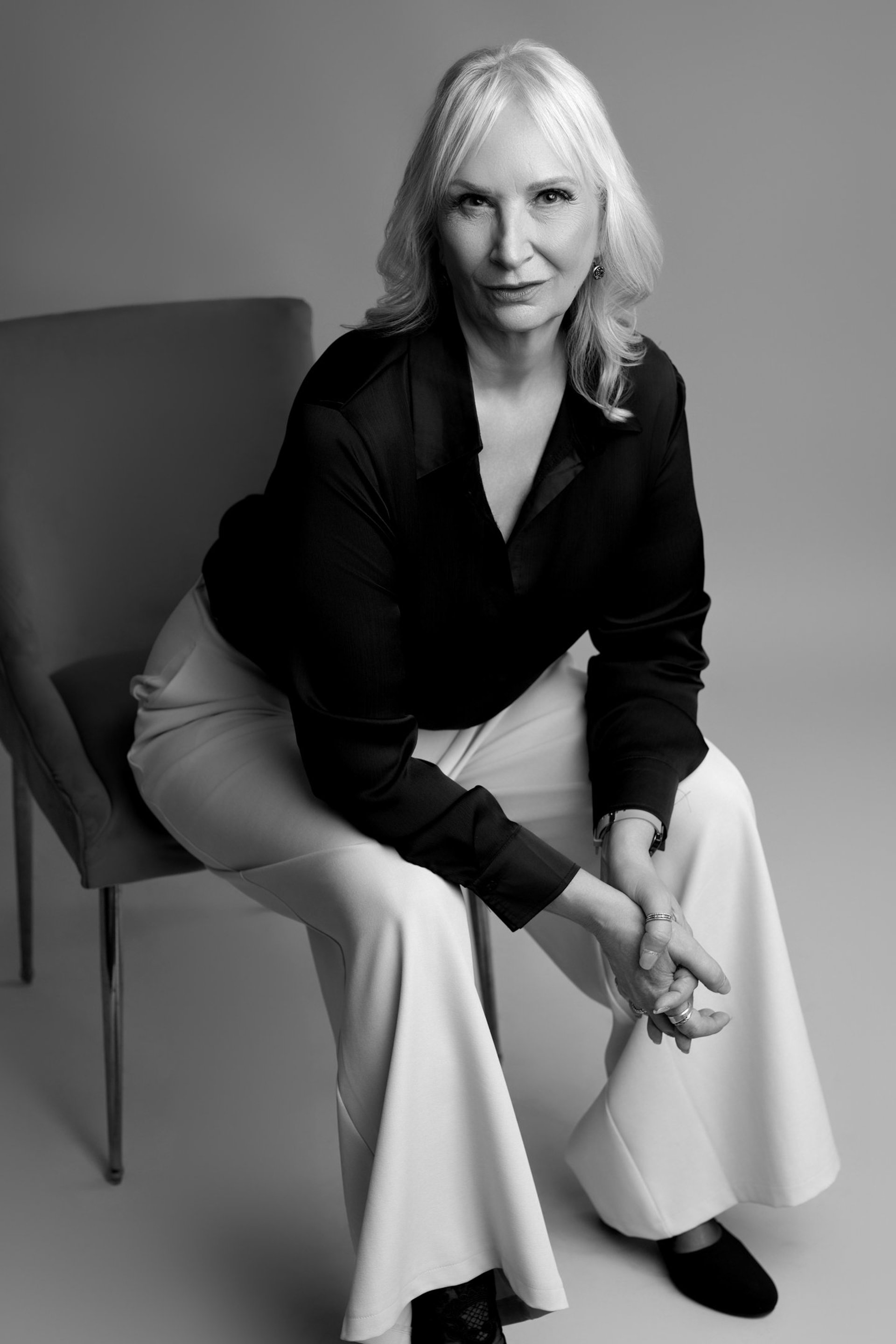 an abstract photo of a curved building with a blue sky in the background