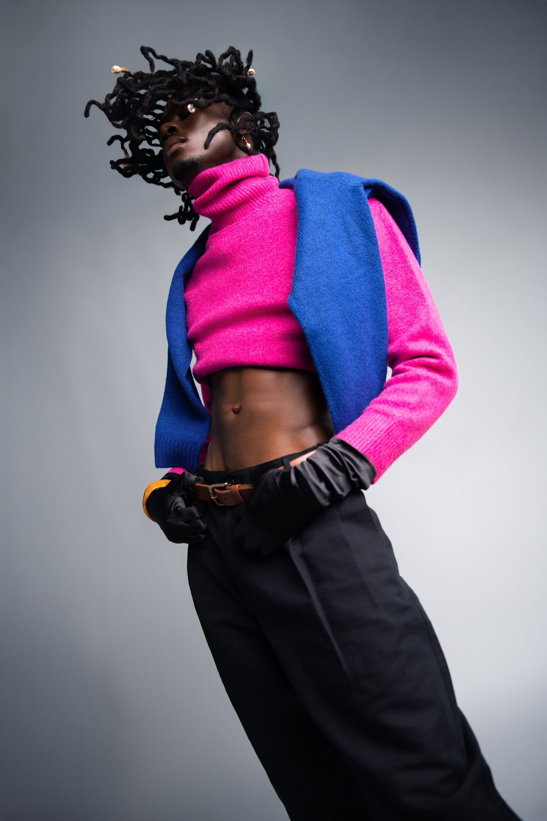 an abstract photo of a curved building with a blue sky in the background
