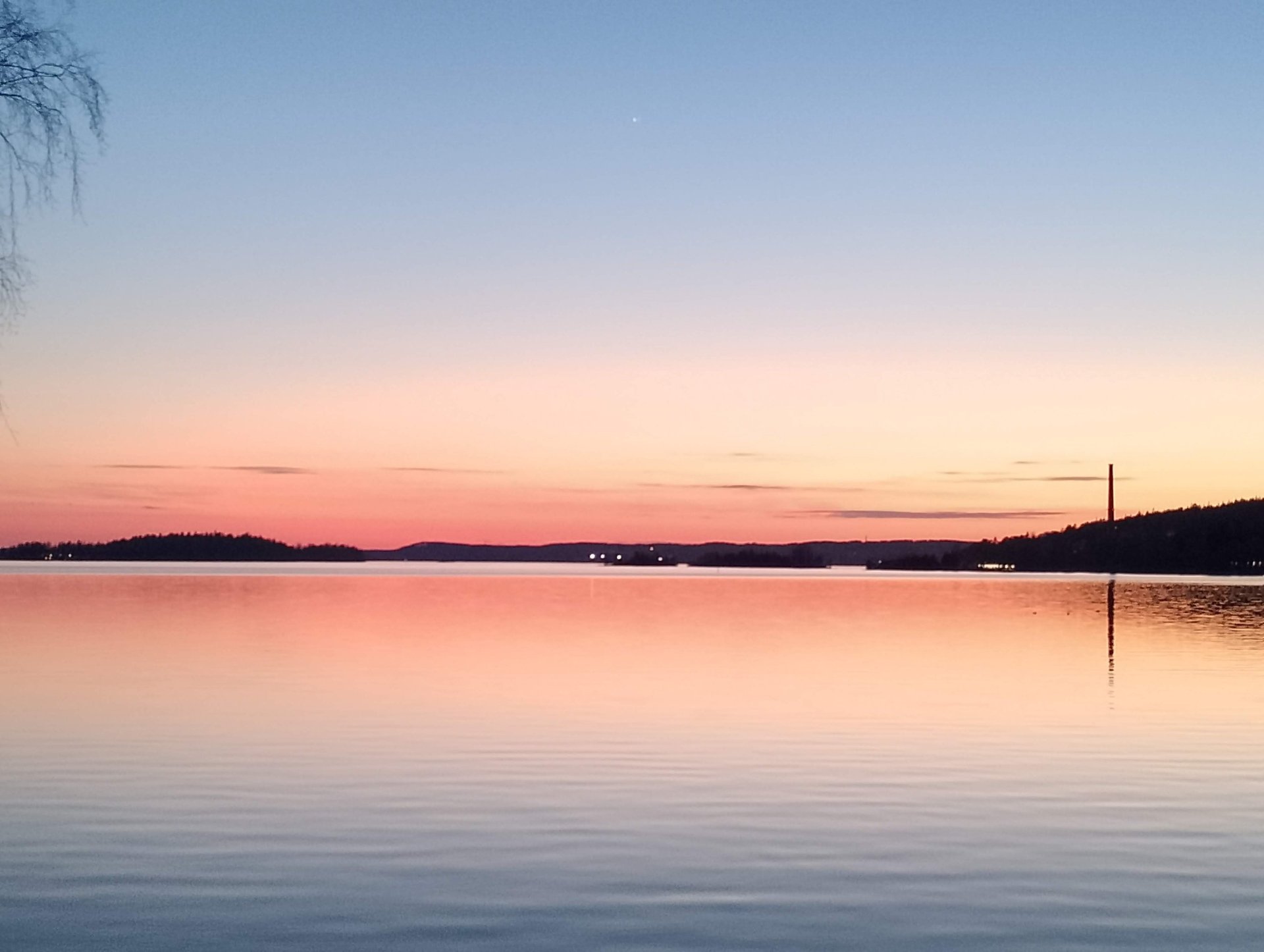 woman sitting on the stone in front of the ocean