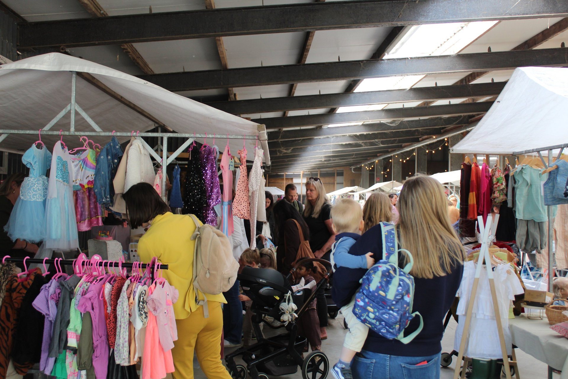 woman wearing yellow long-sleeved dress under white clouds and blue sky during daytime