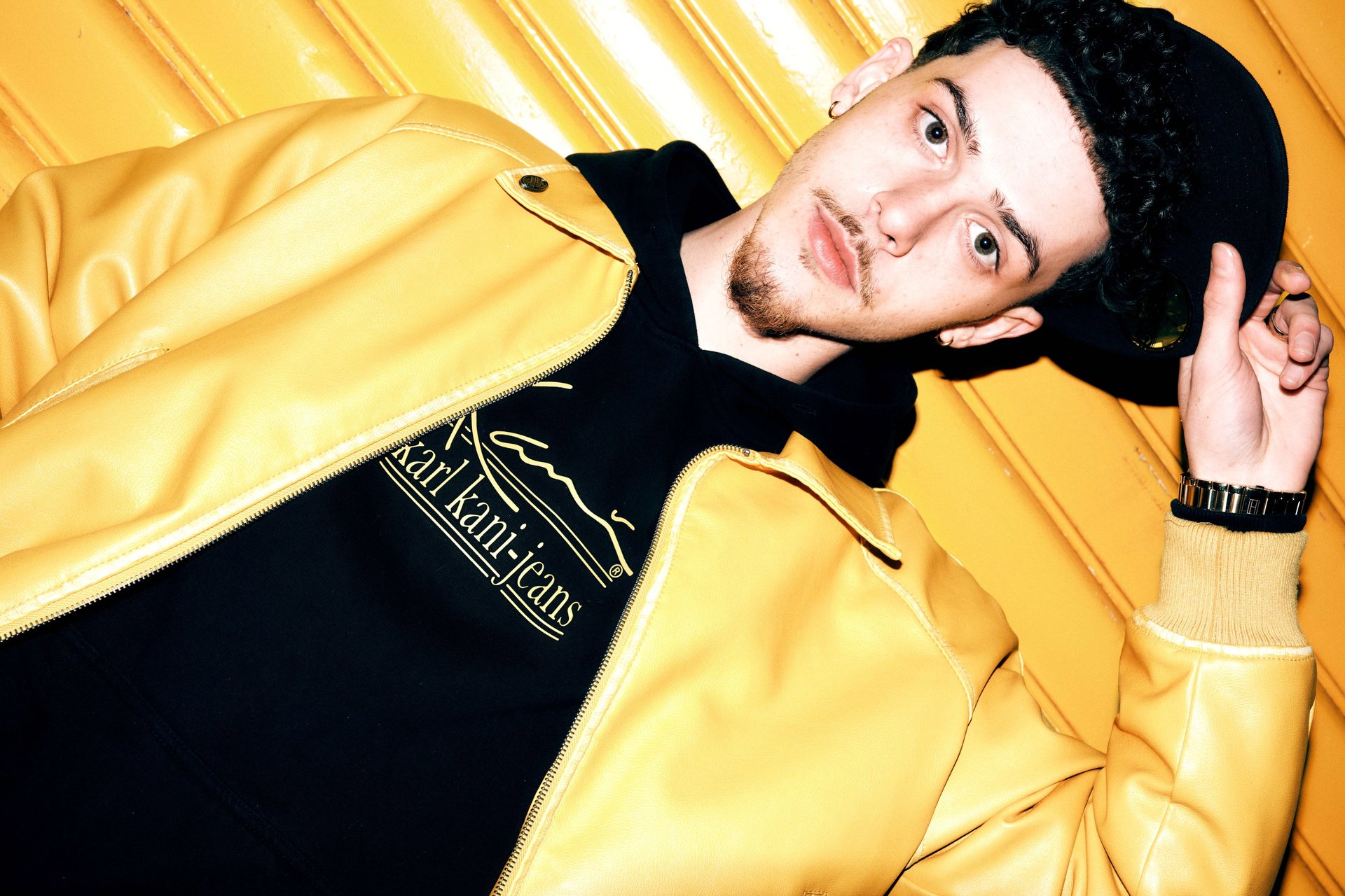 an abstract photo of a curved building with a blue sky in the background