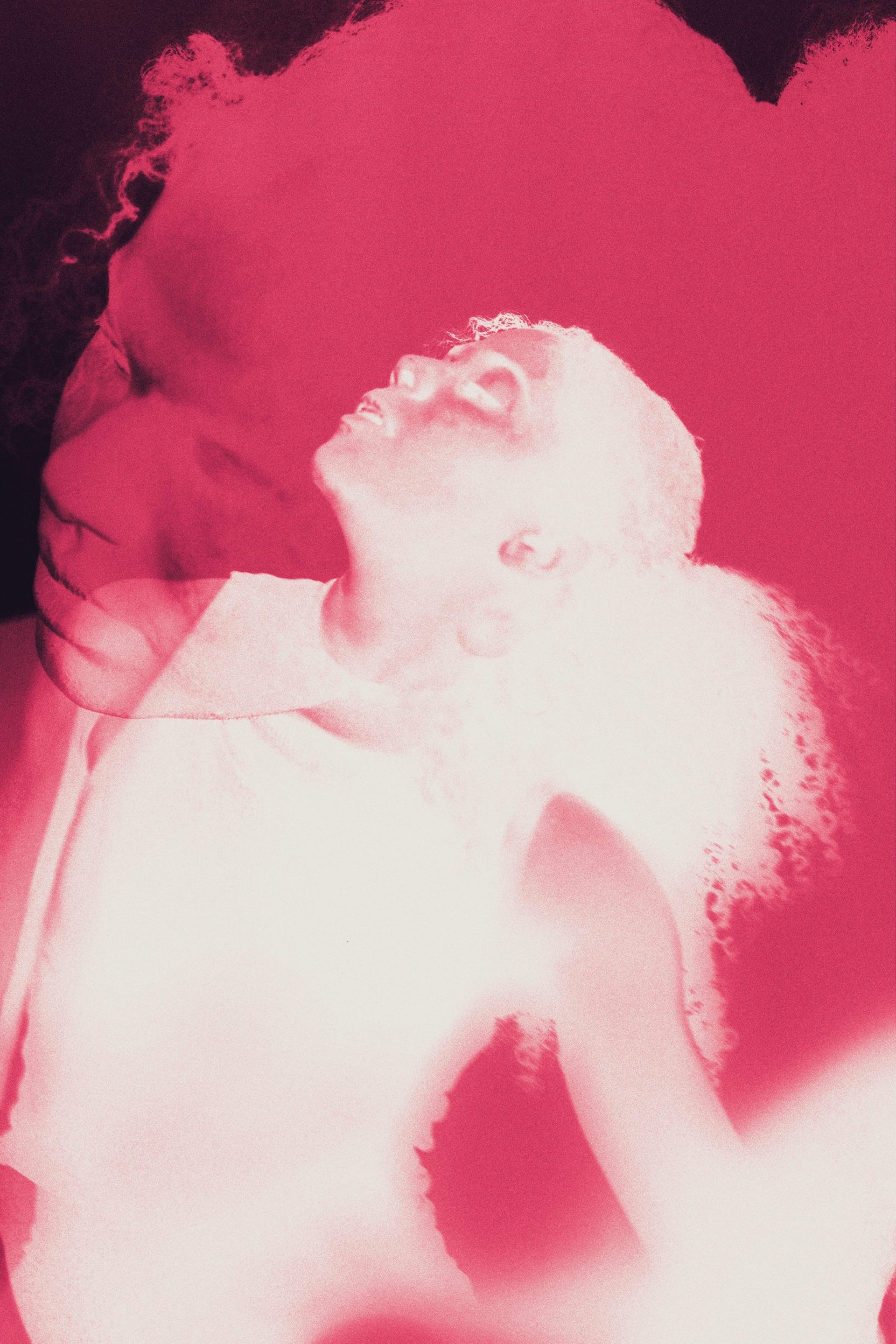 an abstract photo of a curved building with a blue sky in the background