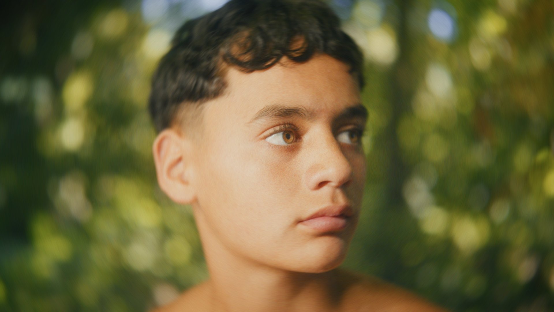 an abstract photo of a curved building with a blue sky in the background