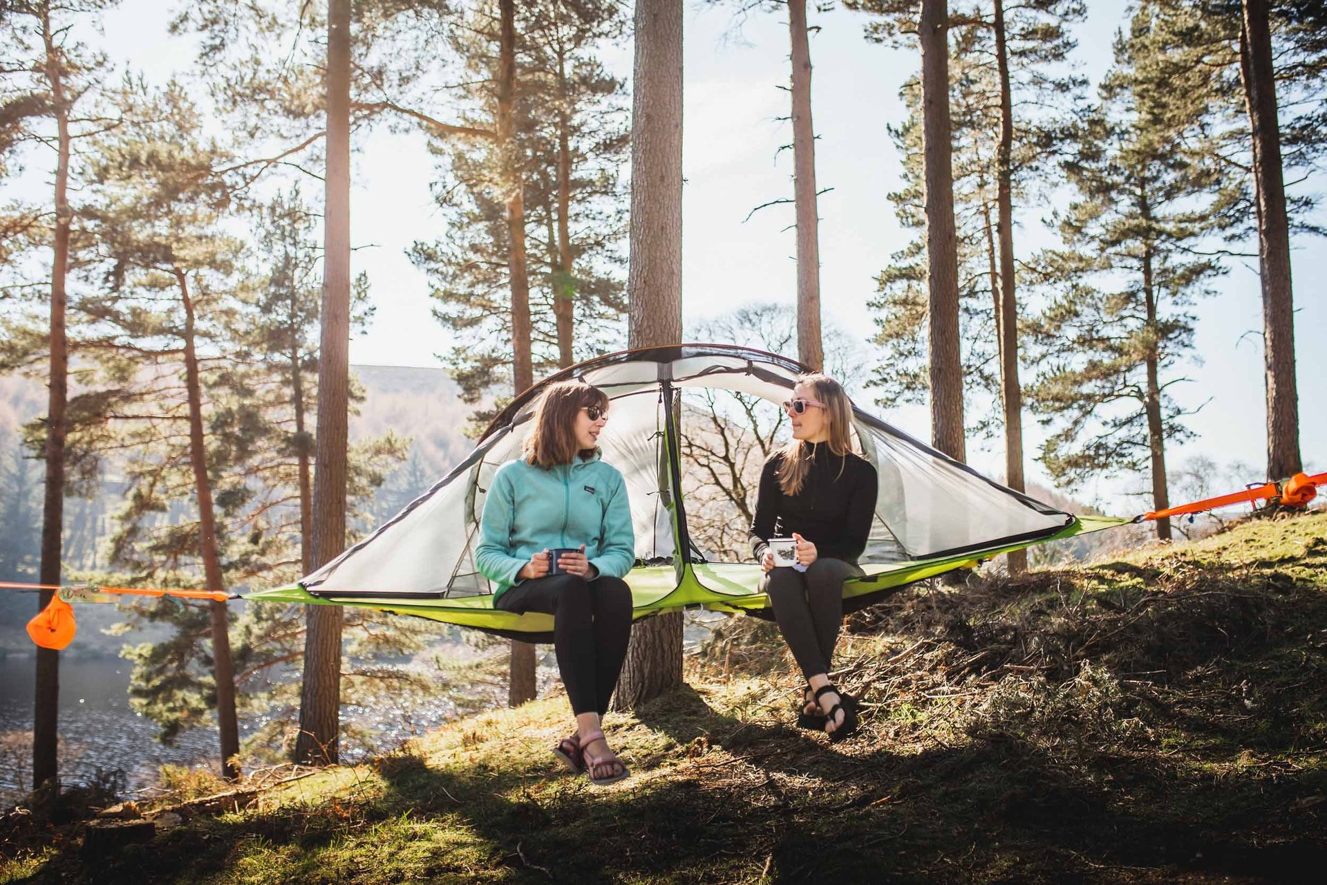 woman wearing yellow long-sleeved dress under white clouds and blue sky during daytime