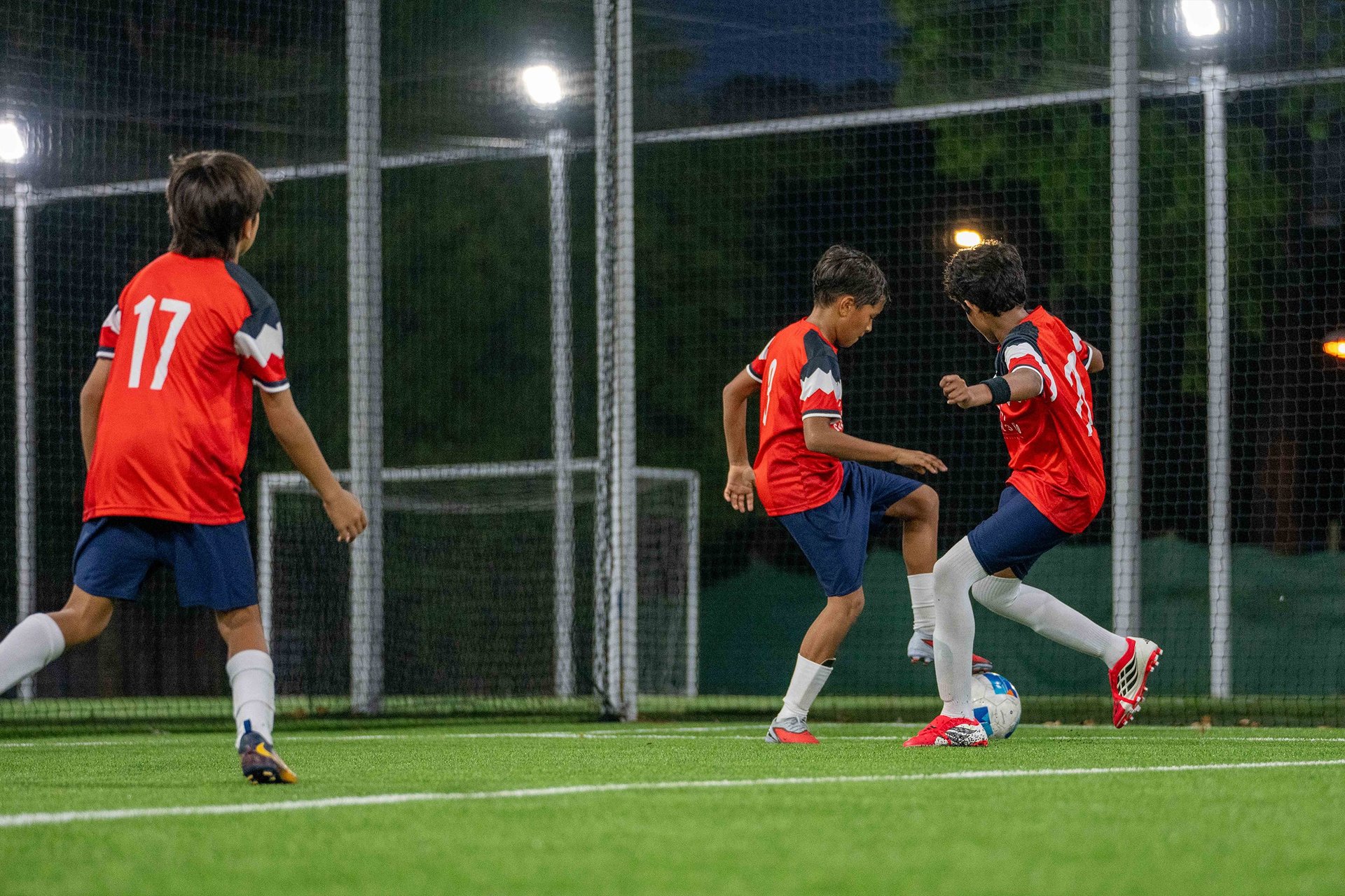 white and blue soccer ball on green grass field
