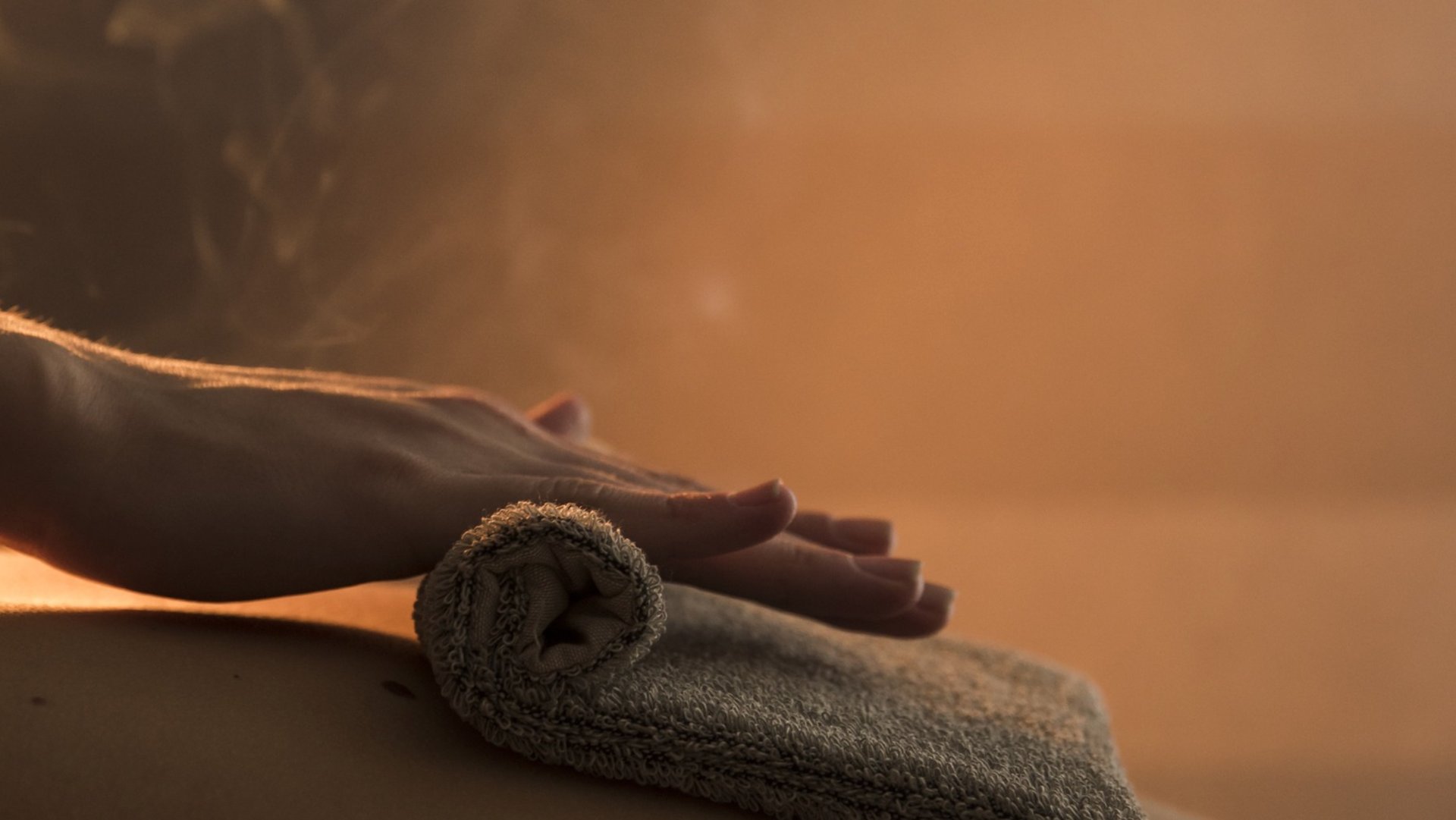 a couple of women laying on top of a wooden floor