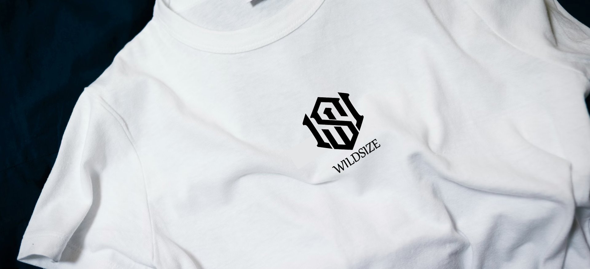 white hotel-printed crew-neck shirt on black surface