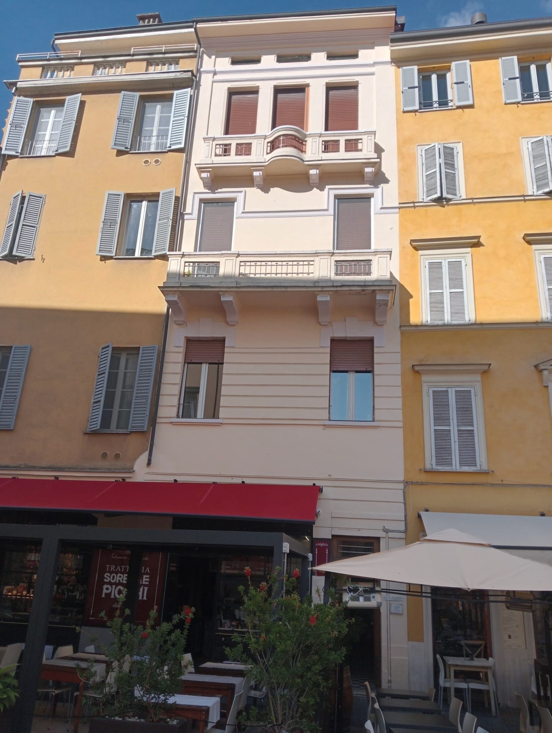 woman wearing yellow long-sleeved dress under white clouds and blue sky during daytime