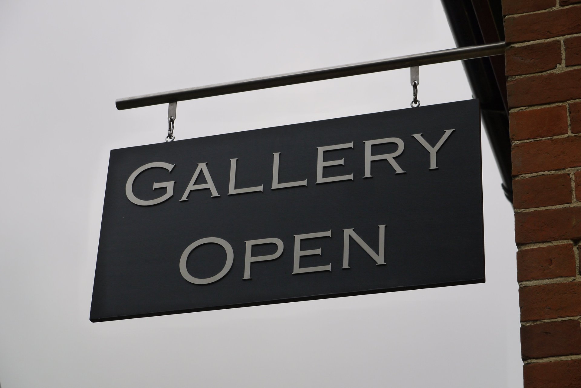 an abstract photo of a curved building with a blue sky in the background