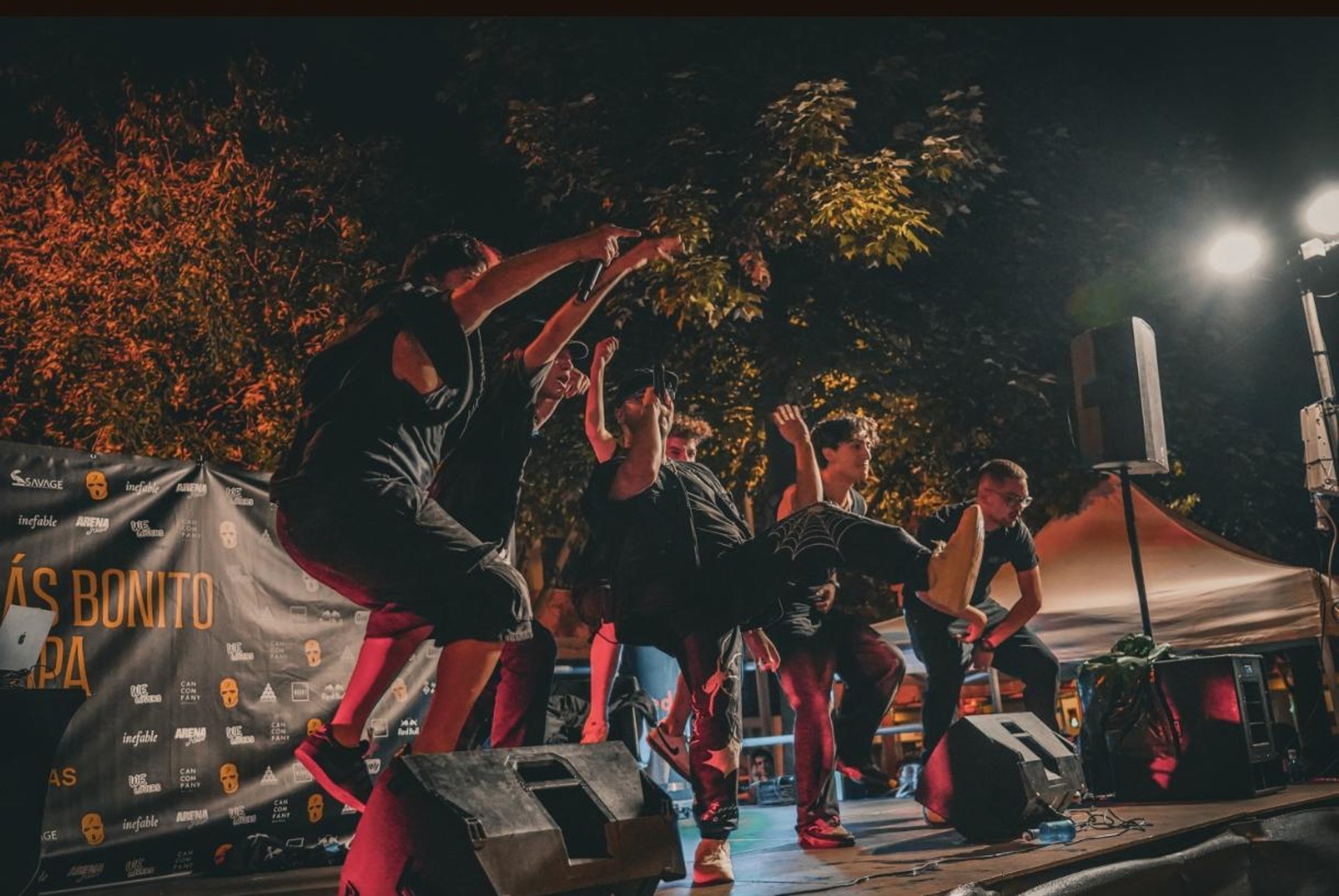 an abstract photo of a curved building with a blue sky in the background