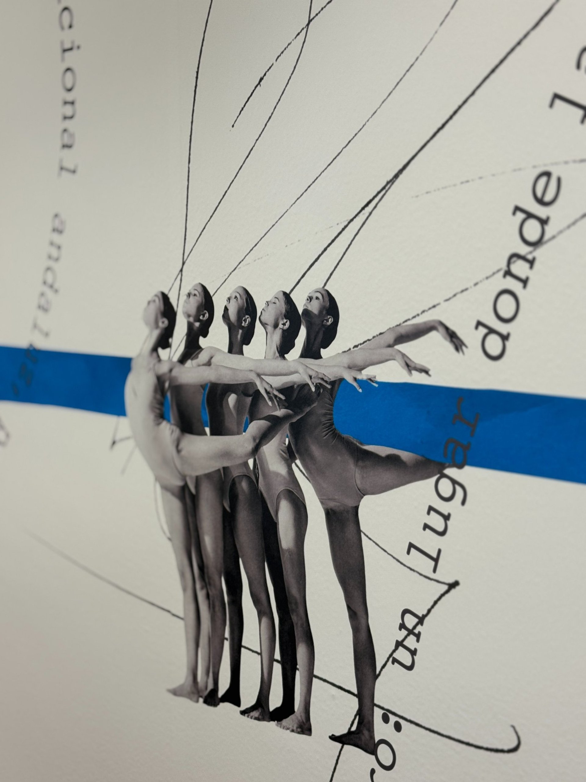 an abstract photo of a curved building with a blue sky in the background