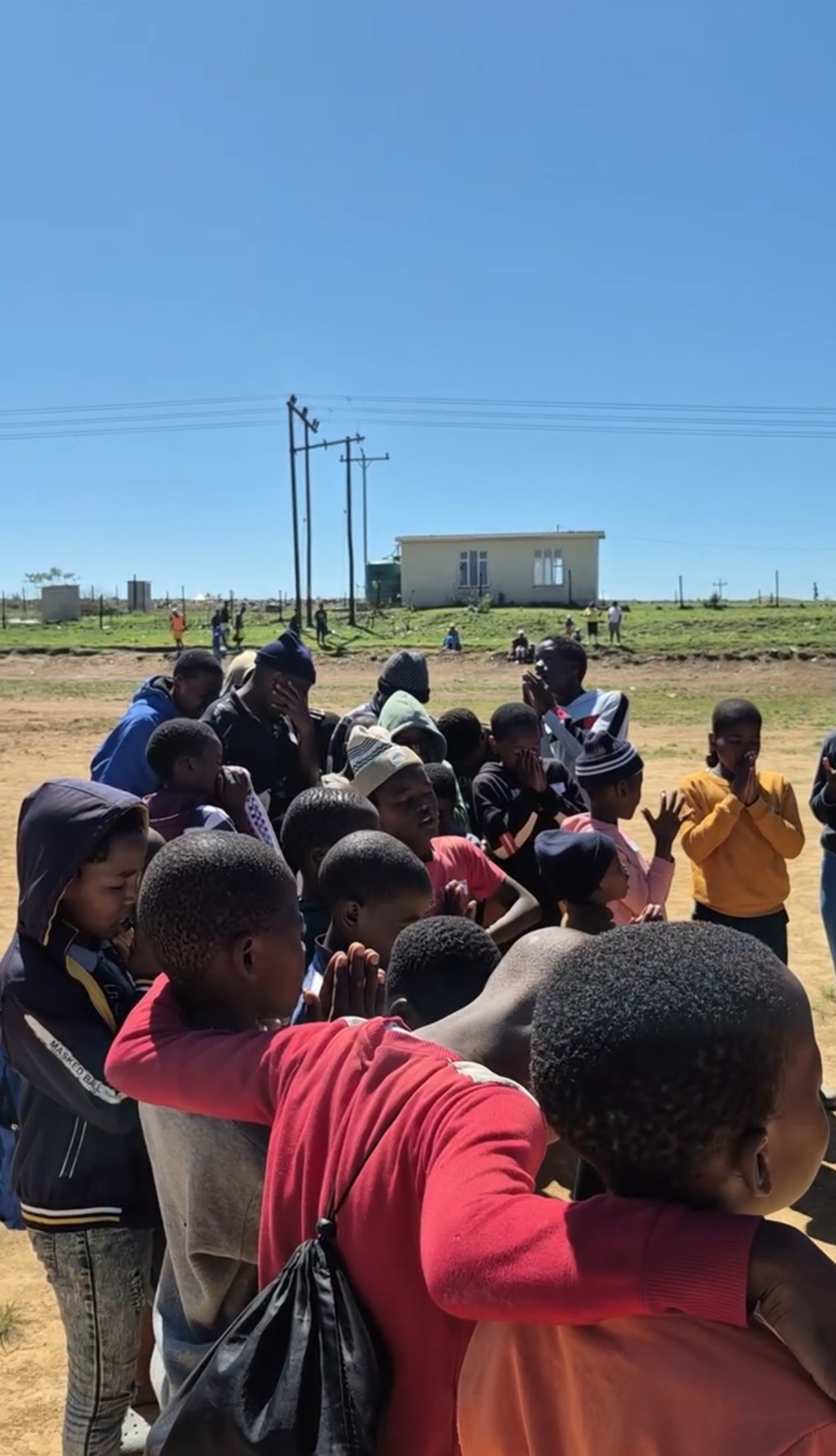 an abstract photo of a curved building with a blue sky in the background