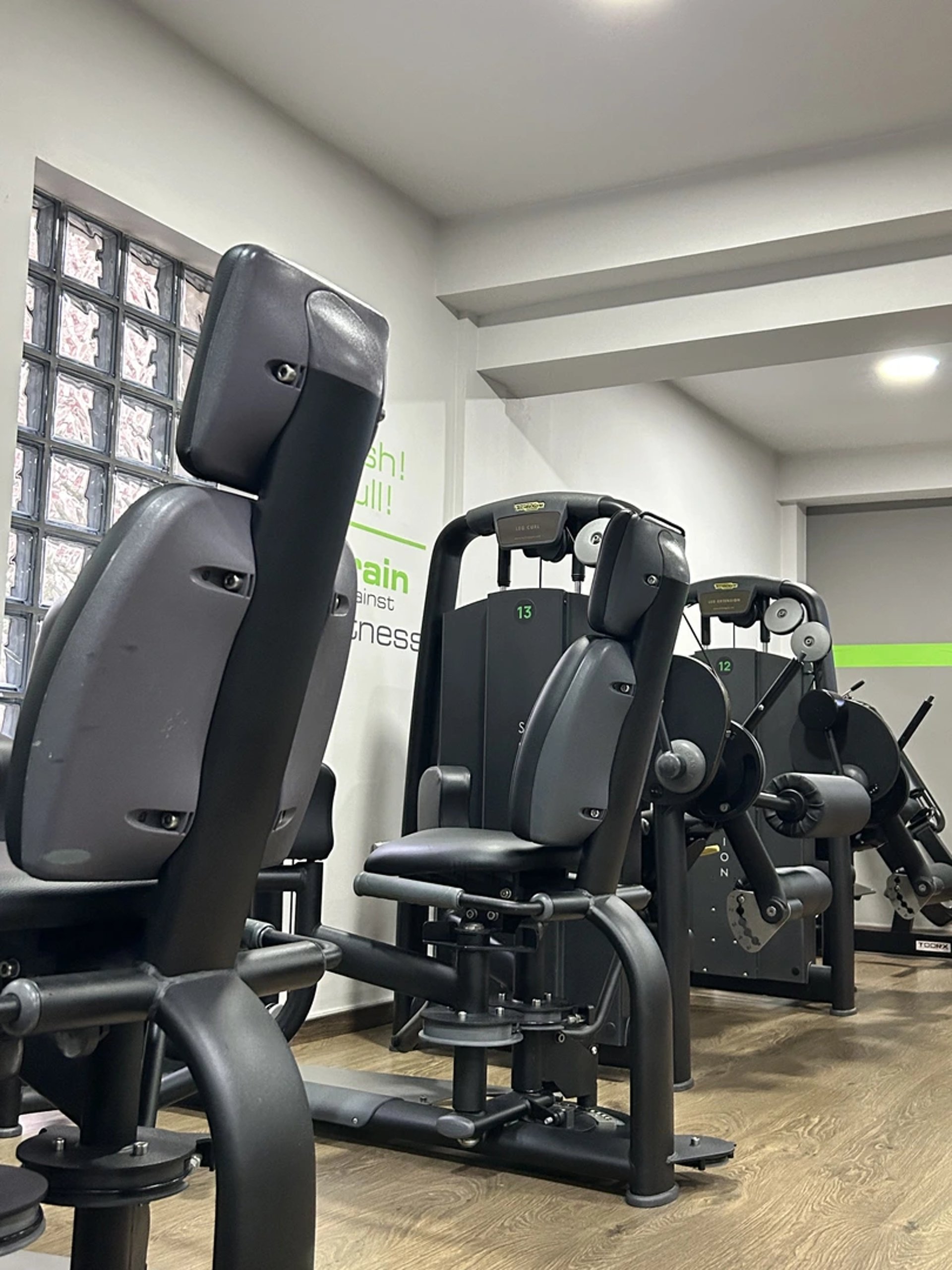 black and silver dumbbells on rack