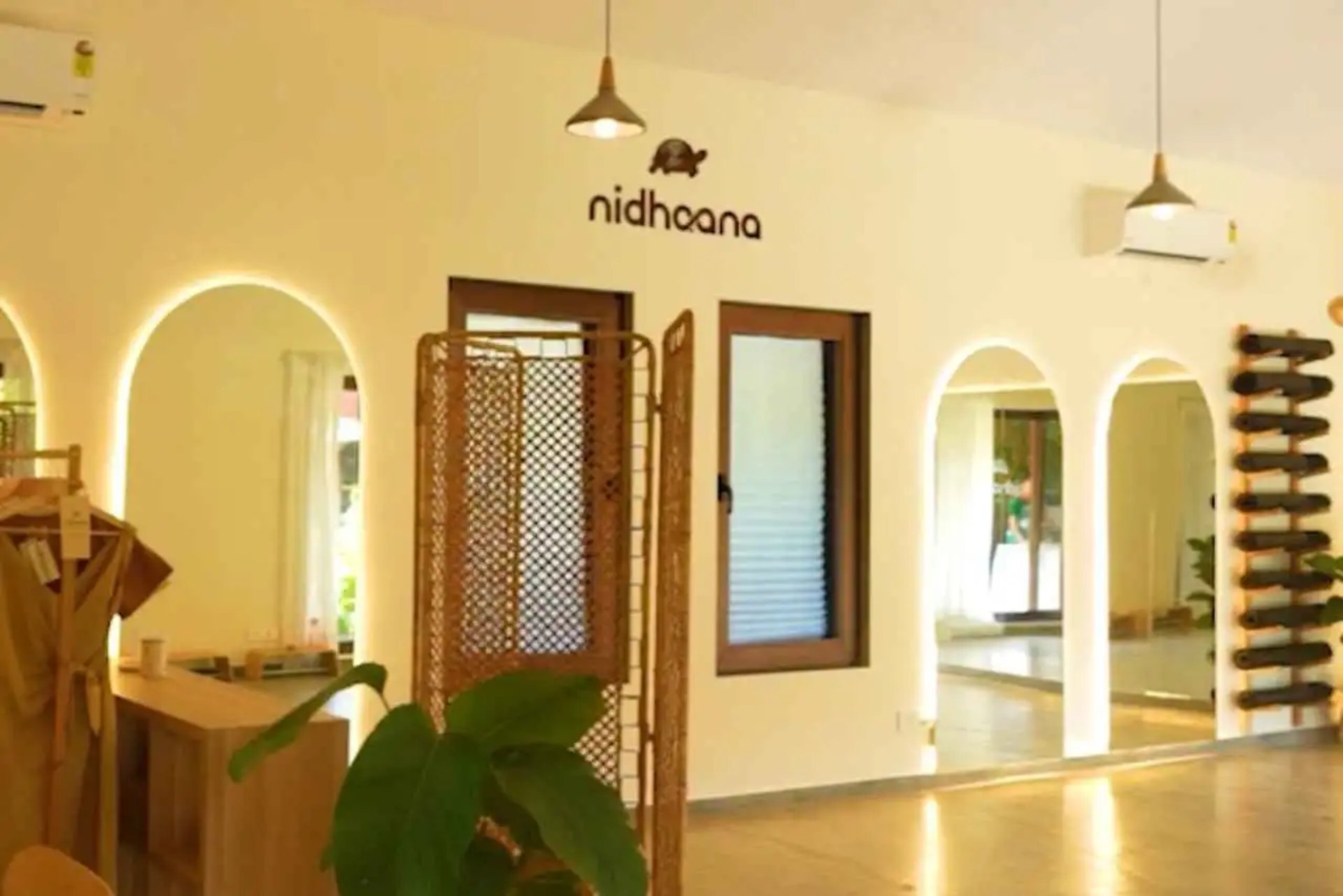 black and brown leather padded tub sofa