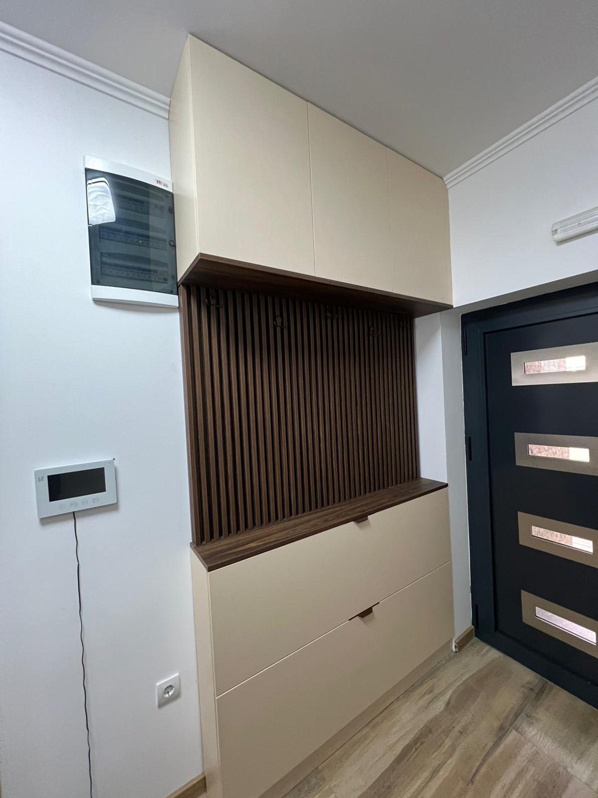white wooden kitchen island and cupboard cabinets near glass panel door