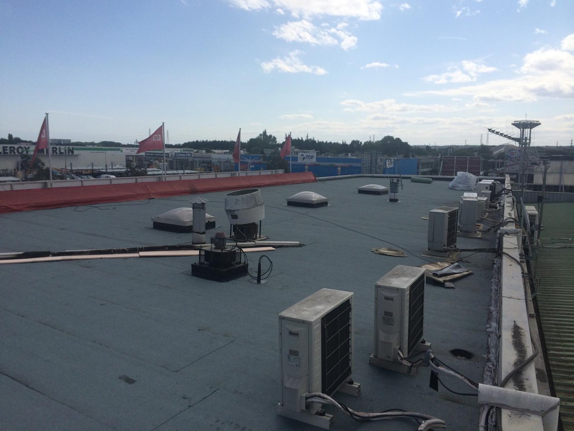 a person wearing blue gloves and holding a hammer