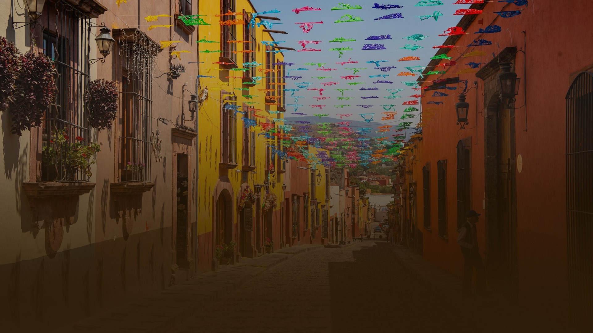 an abstract photo of a curved building with a blue sky in the background