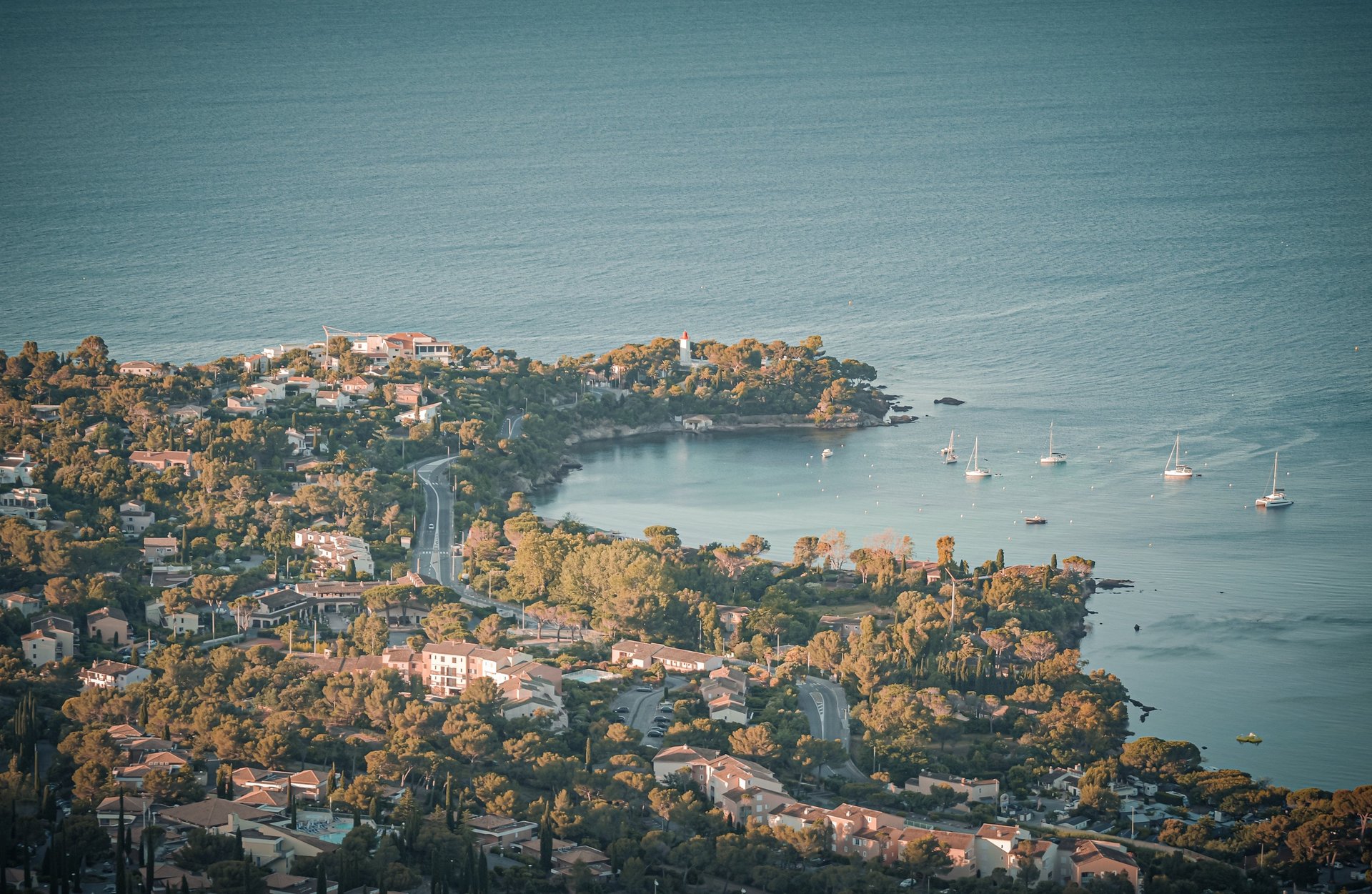 an abstract photo of a curved building with a blue sky in the background