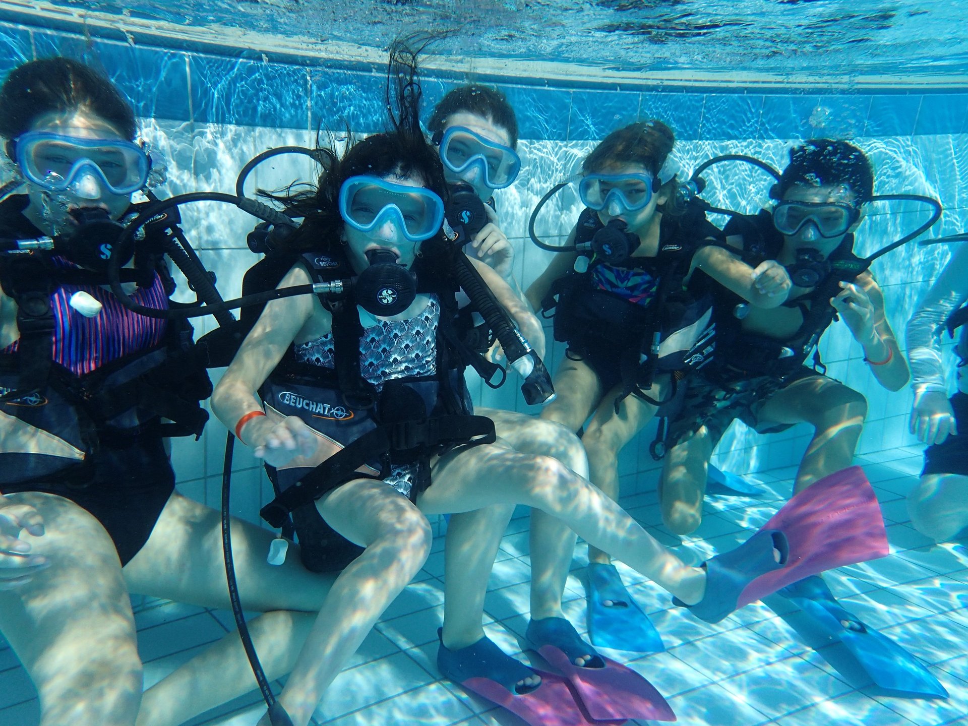 an abstract photo of a curved building with a blue sky in the background