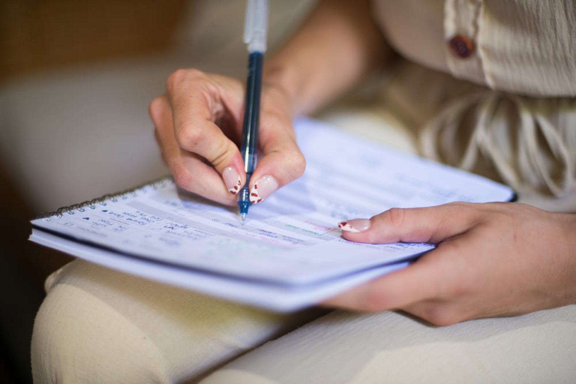 hands writing on notebok. mentoring