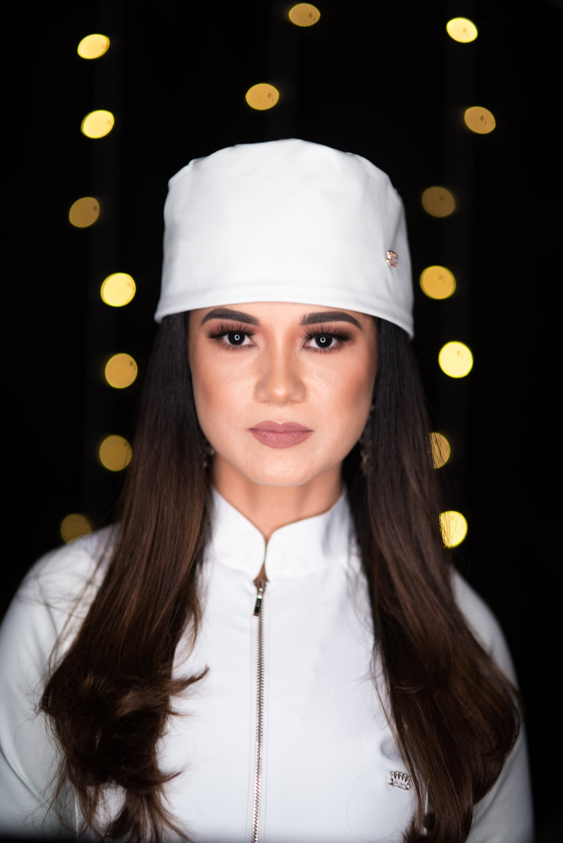 A woman in a hospital gown is getting an injection